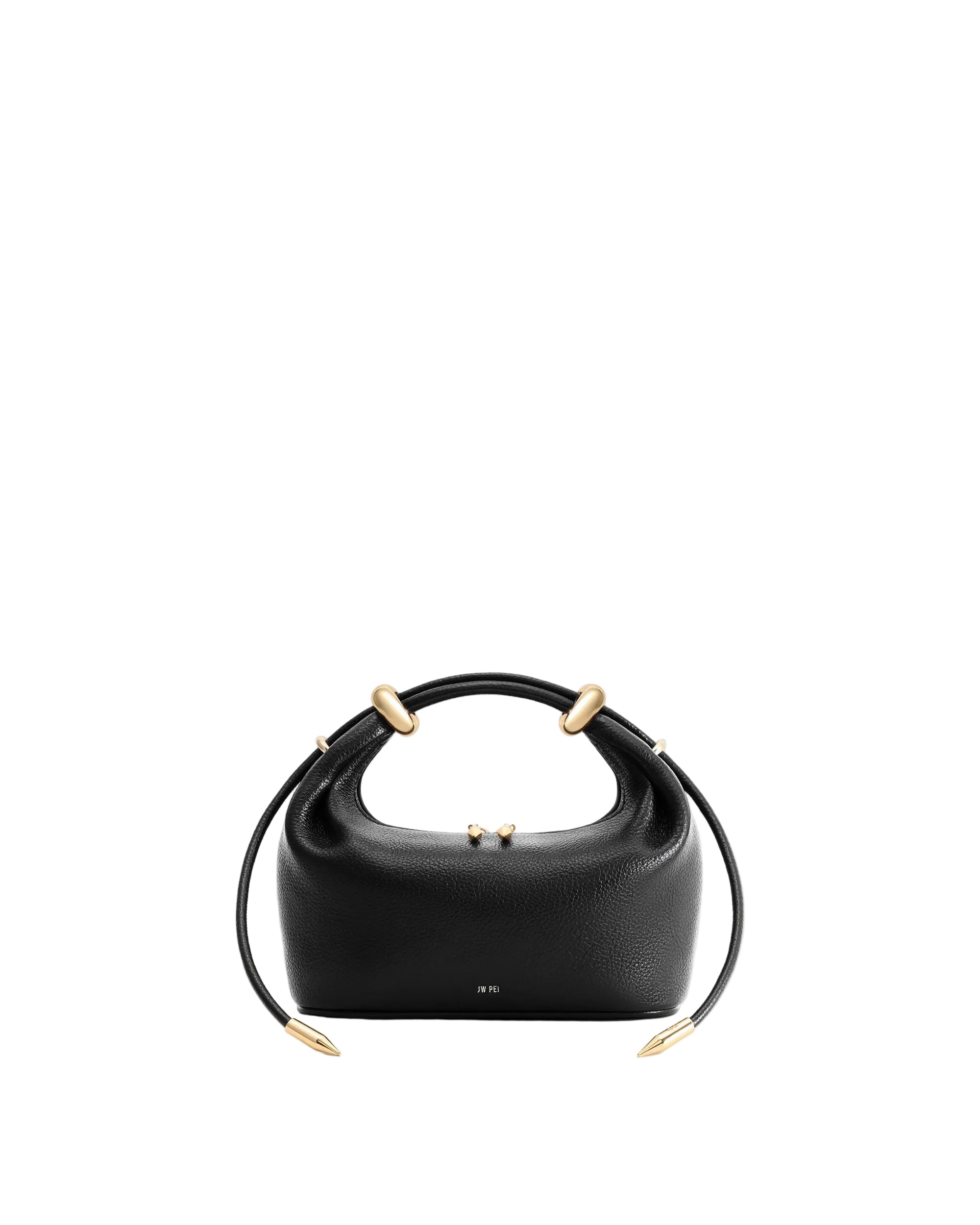 Black pebbled leather top-handle bag with two rounded handles, four gold-toned metal rings, and a strap with pointed gold-ton