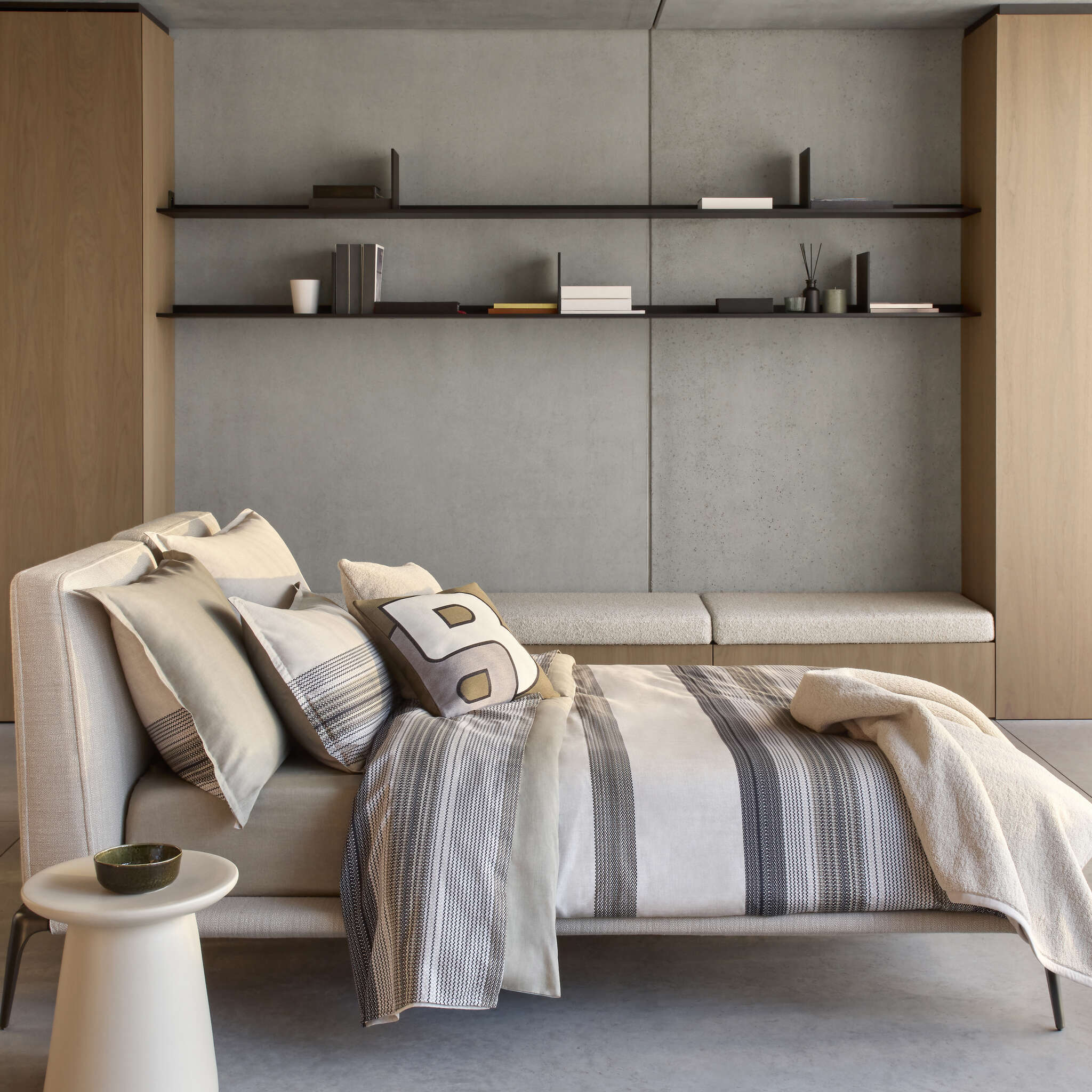 HUGO BOSS Modernis duvet cover set with beige, cream, and dark grey vertical stripes, and matching pillowcases.