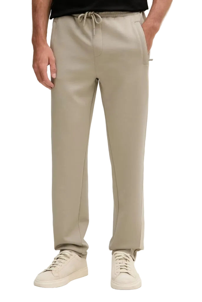 Khaki men's sporty sweatpants with an elasticated drawstring waistband, side pockets, and a subtle logo tape accent.
