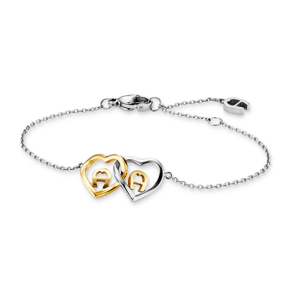Silver-toned stainless steel bracelet with delicate chain, one gold-toned and one silver-toned interlocking heart charm, each