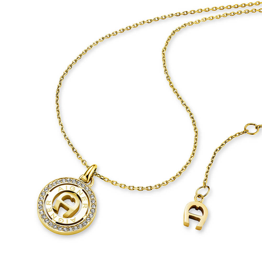 Gold-toned short necklace with a circular pendant featuring the Aigner logo and clear crystal embellishments.
