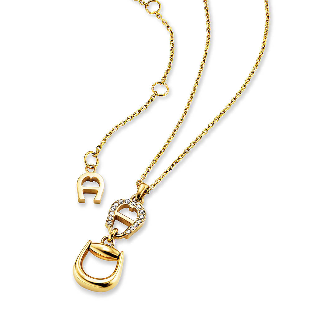 Gold-toned short necklace with a polished stirrup-shaped pendant, an Aigner 'A' logo, and clear pavé-set stones.