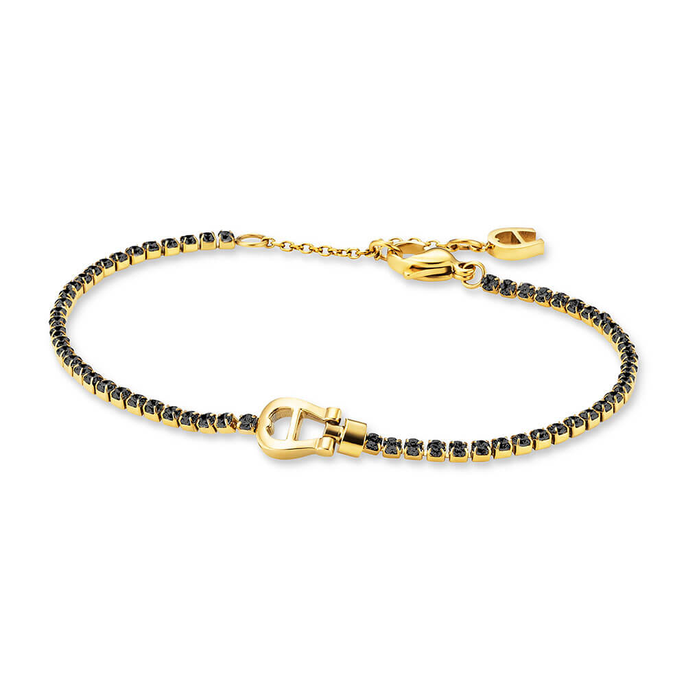 Gold-toned Aigner bracelet with a central horseshoe clasp and a chain of small black faceted stones, featuring an adjustable
