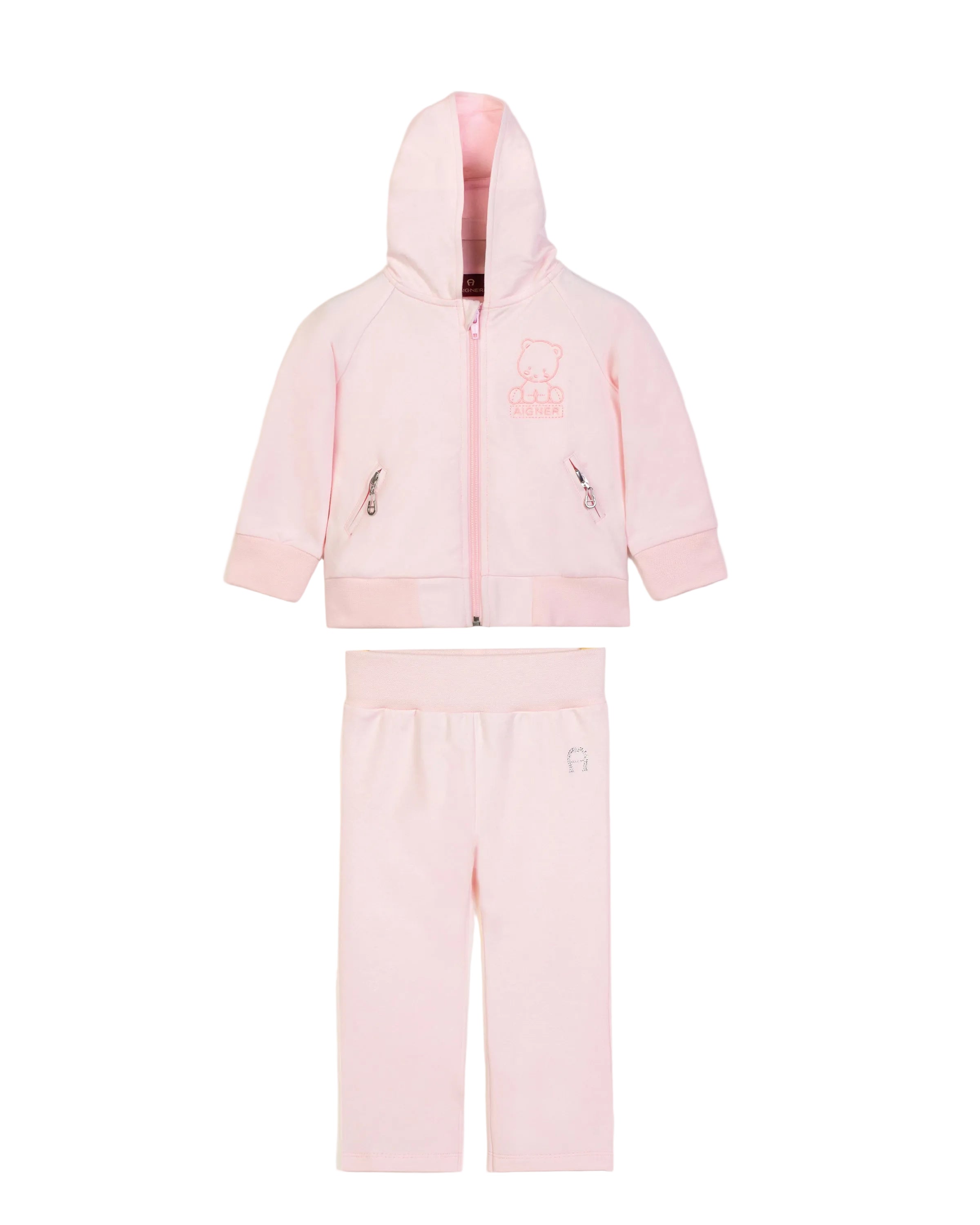 Full studio layout shot of the two-piece Aigner Kids baby girls pale pink tracksuit set, displaying the zip-up hoodie with its embroidered teddy bear chest graphic aligned above the matching pull-on joggers