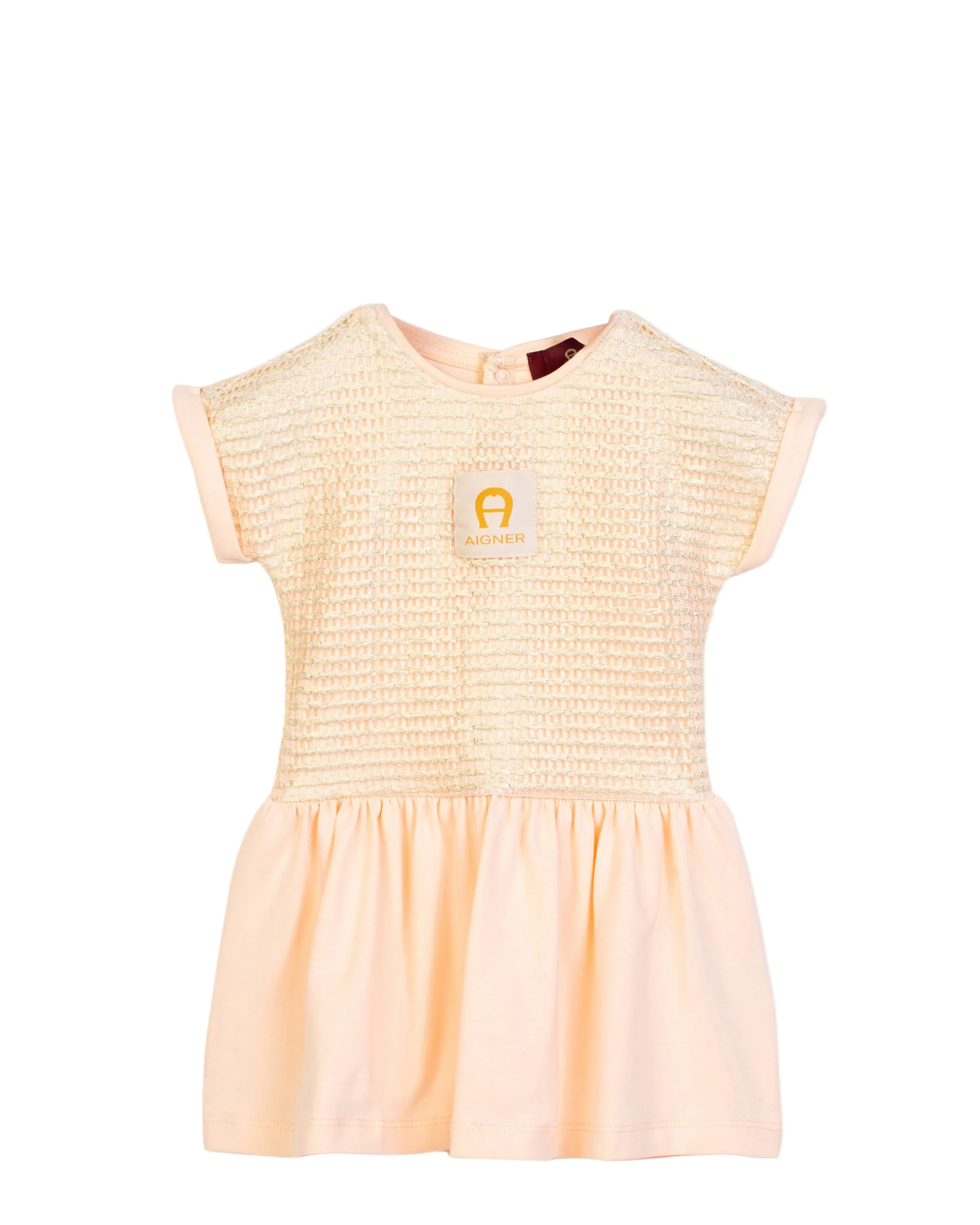 Front view flat-lay studio shot of the Aigner Kids baby girls pale peach short-sleeve dress, highlighting the textured metallic gold thread bodice and central horseshoe logo patch.