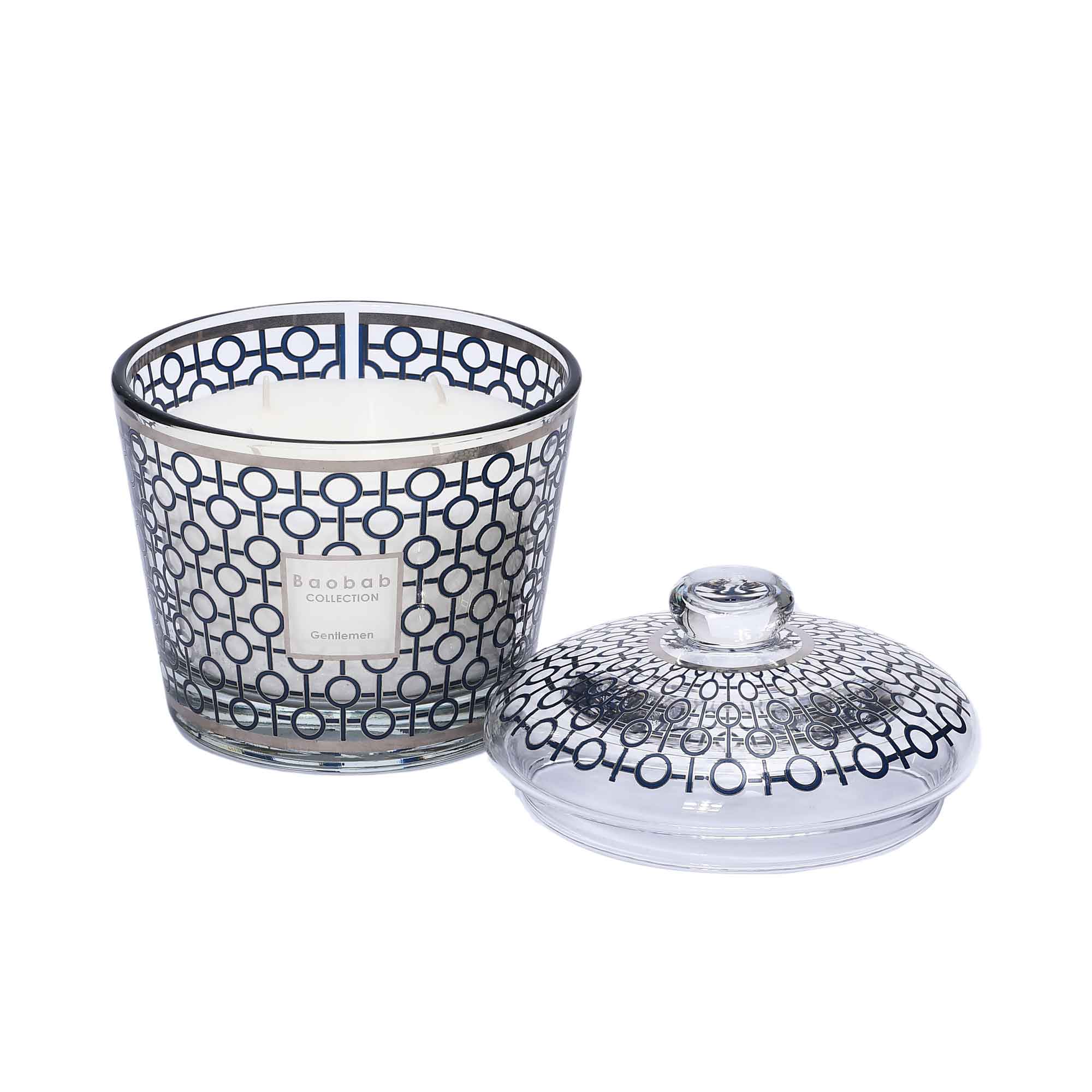 The Gentlemen candle displayed with its decorative glass dome placed alongside, showing the white wax and multi-wick interior.