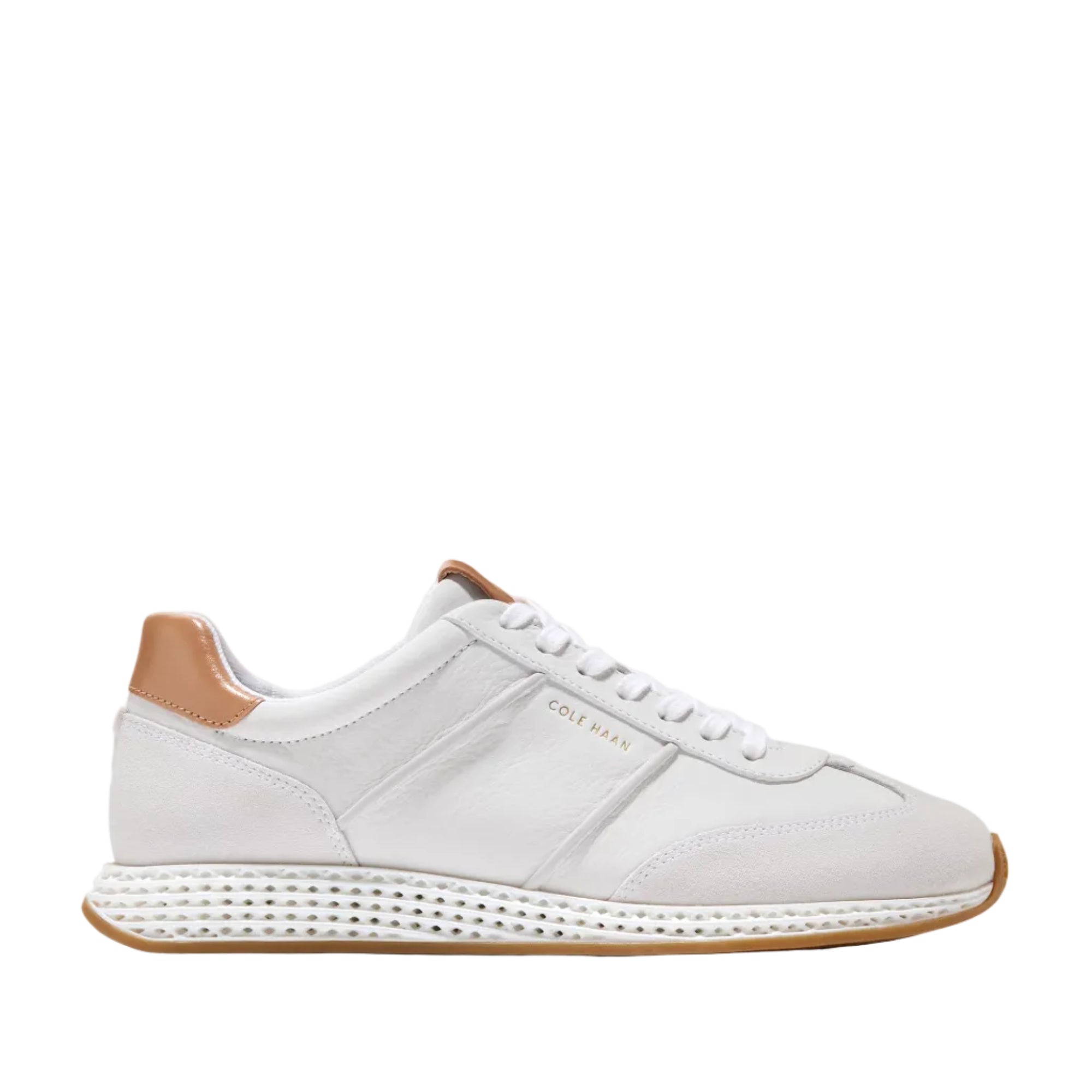 White Cole Haan Women's GrandPrø Low Profile SkyWeave™ sneakers with a tan heel tab and brown rubber outsole.