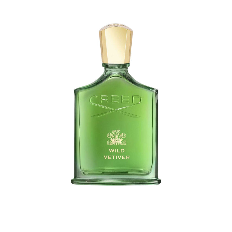 A translucent green glass bottle of Creed Wild Vetiver perfume with a gold cap, featuring the embossed Creed logo and gold lettering against a white background.
