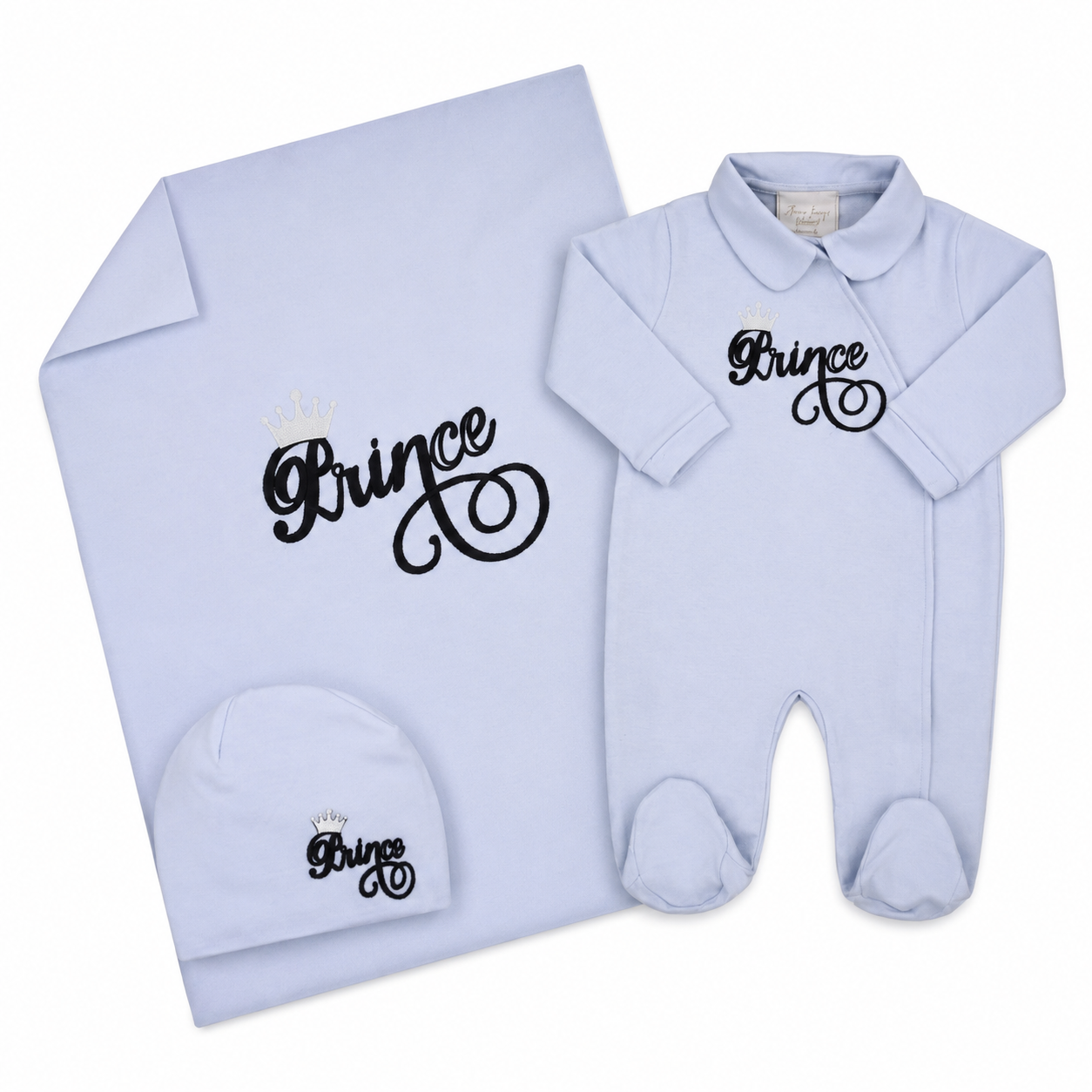 Light blue baby sleepsuit set including a long-sleeved sleepsuit, blanket, and beanie hat, all with 'Prince' crown embroidery