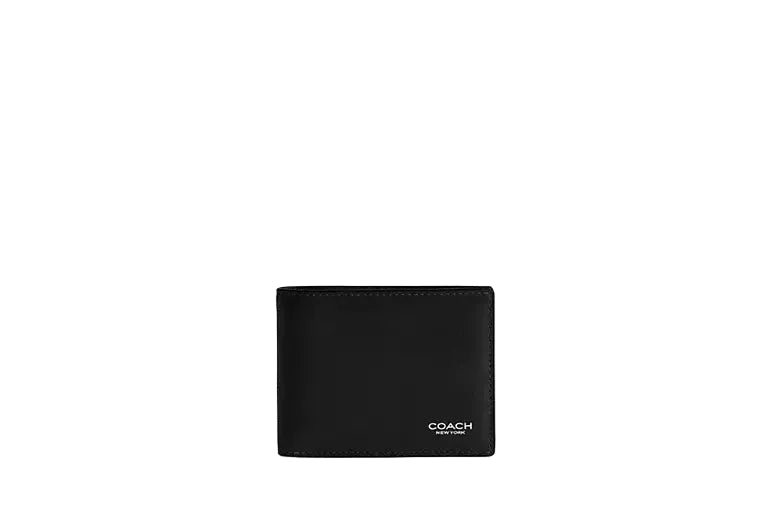 Front view of a closed Coach slim bifold wallet in black leather featuring a small silver Coach logo at the bottom corner.