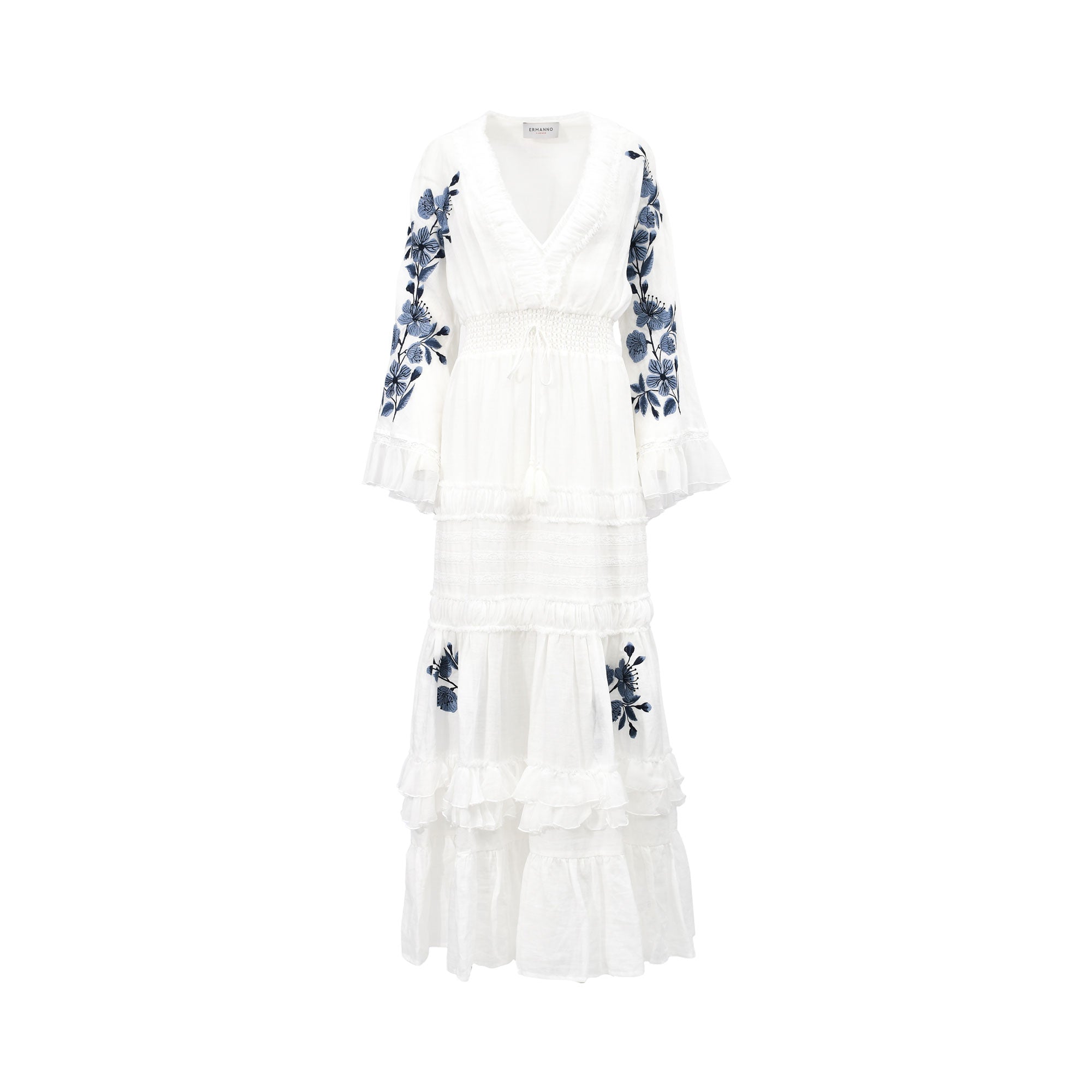 Front view of an Ermanno white maxi dress featuring blue botanical embroidery on the bell sleeves and tiered ruffled skirt from BLUE SALON shop.