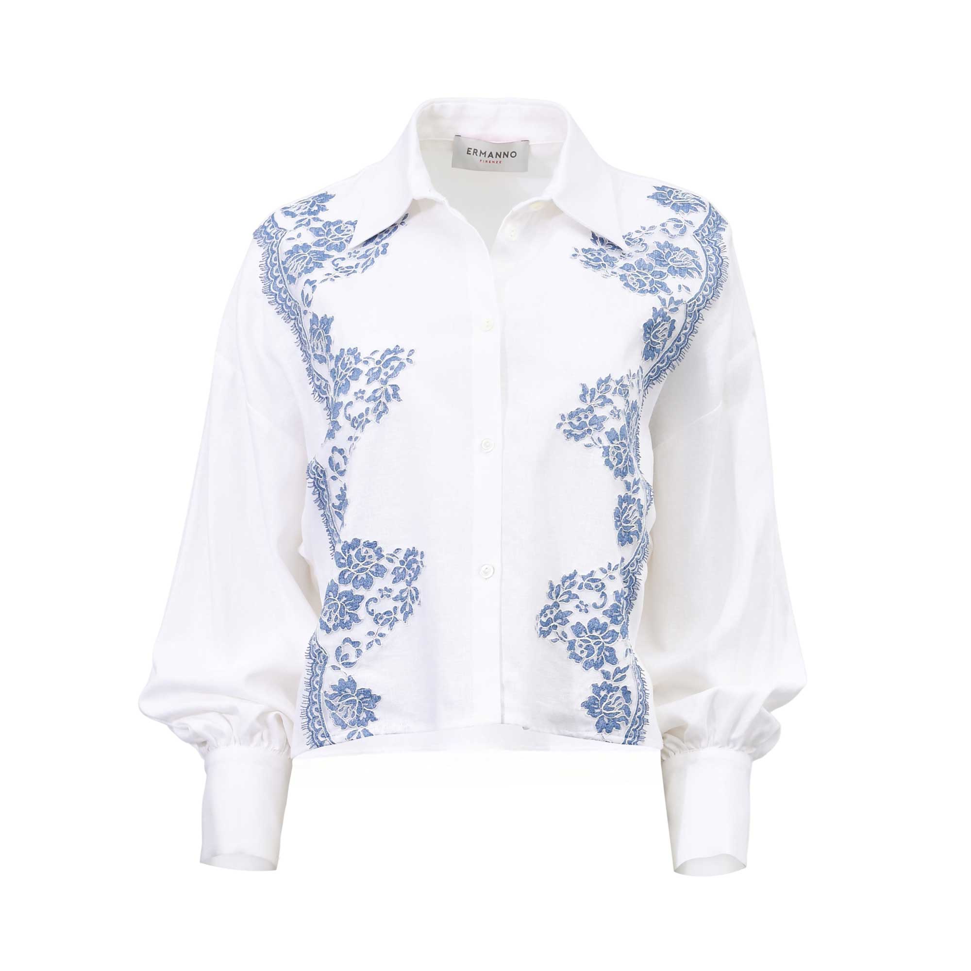 Front view of an Ermanno Firenze white blouse featuring blue floral lace applique along the front panels and balloon sleeves from BLUE SALON shop.