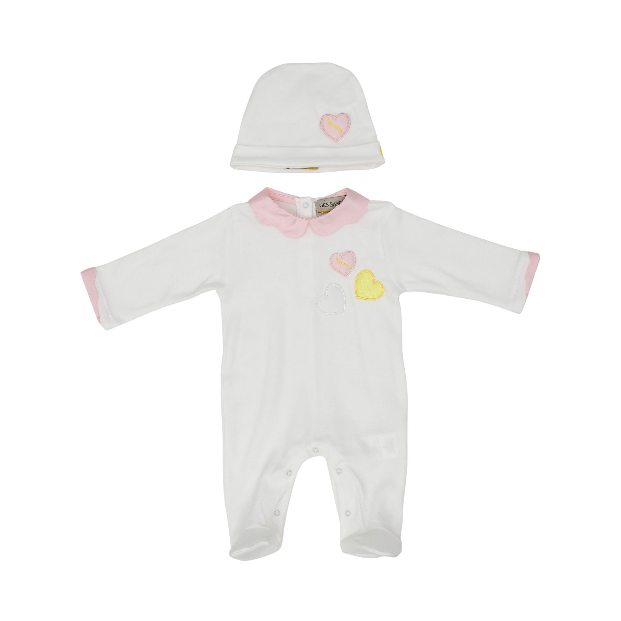 Front view of a white baby onesie with a pink collar, pink cuffs, and embroidered hearts, shown with a matching white beanie with a pink heart.