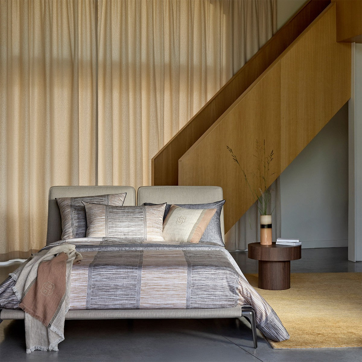 Hugo Boss Taman bedding set with duvet cover, flat sheet, and four pillowcases in grey, beige, and off-white horizontal strip