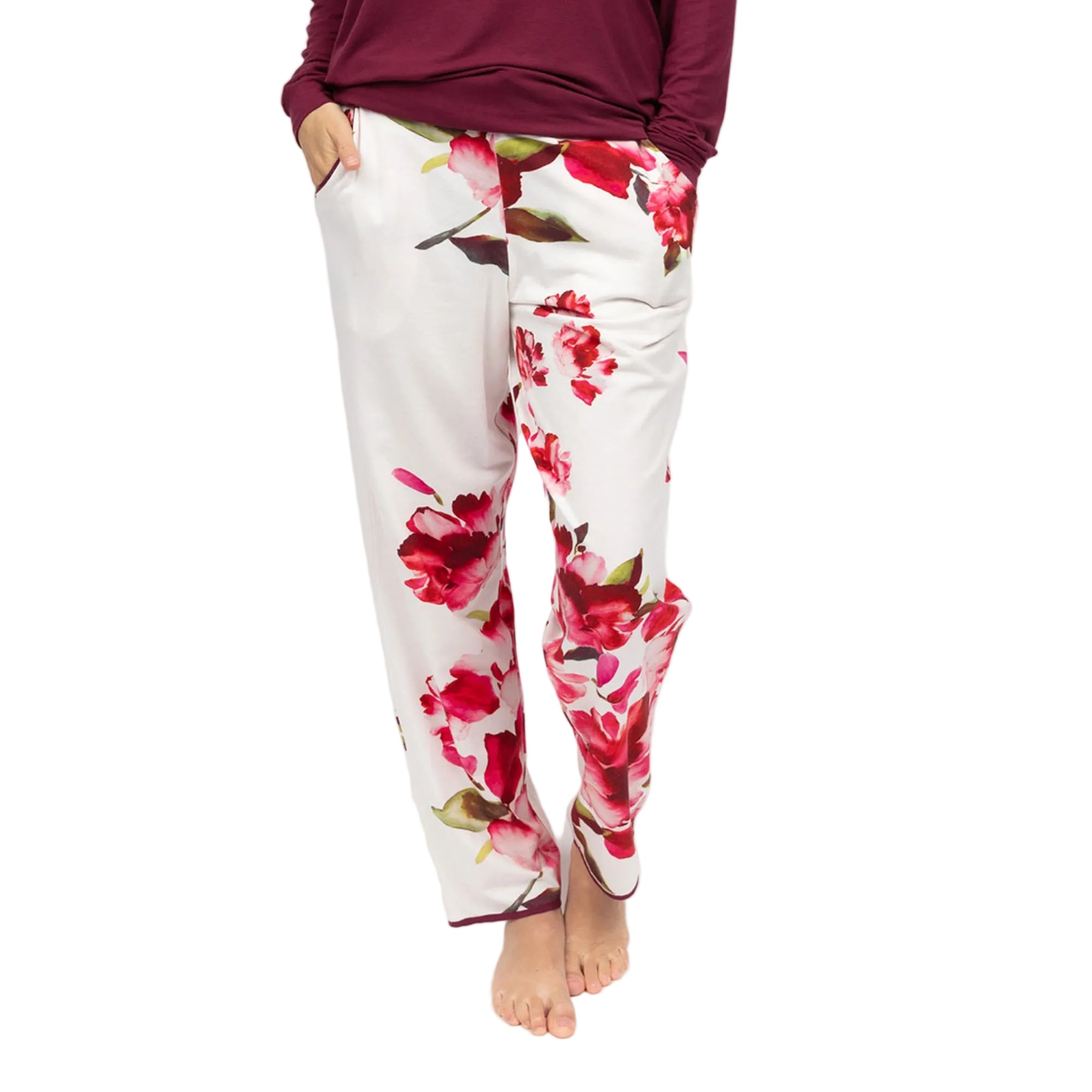 White pyjama bottoms with ox blood and pink floral print, featuring side pockets and an ox blood hem trim.