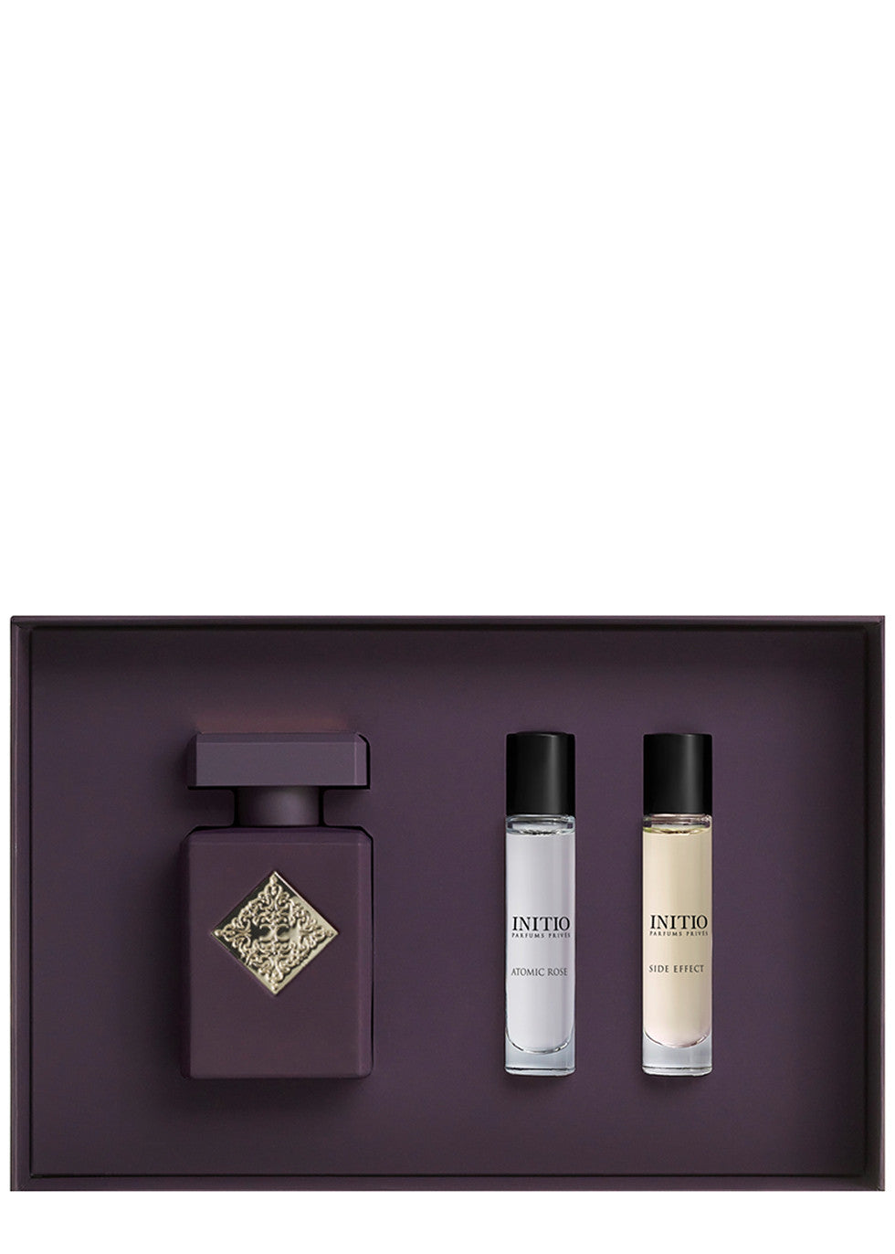 Initio Parfums Privés Atomic Rose discovery gift set presented inside a deep purple insert, featuring a 50ml main perfume bottle alongside two 10ml travel sprays of Atomic Rose and Side Effect, available at blue salon.