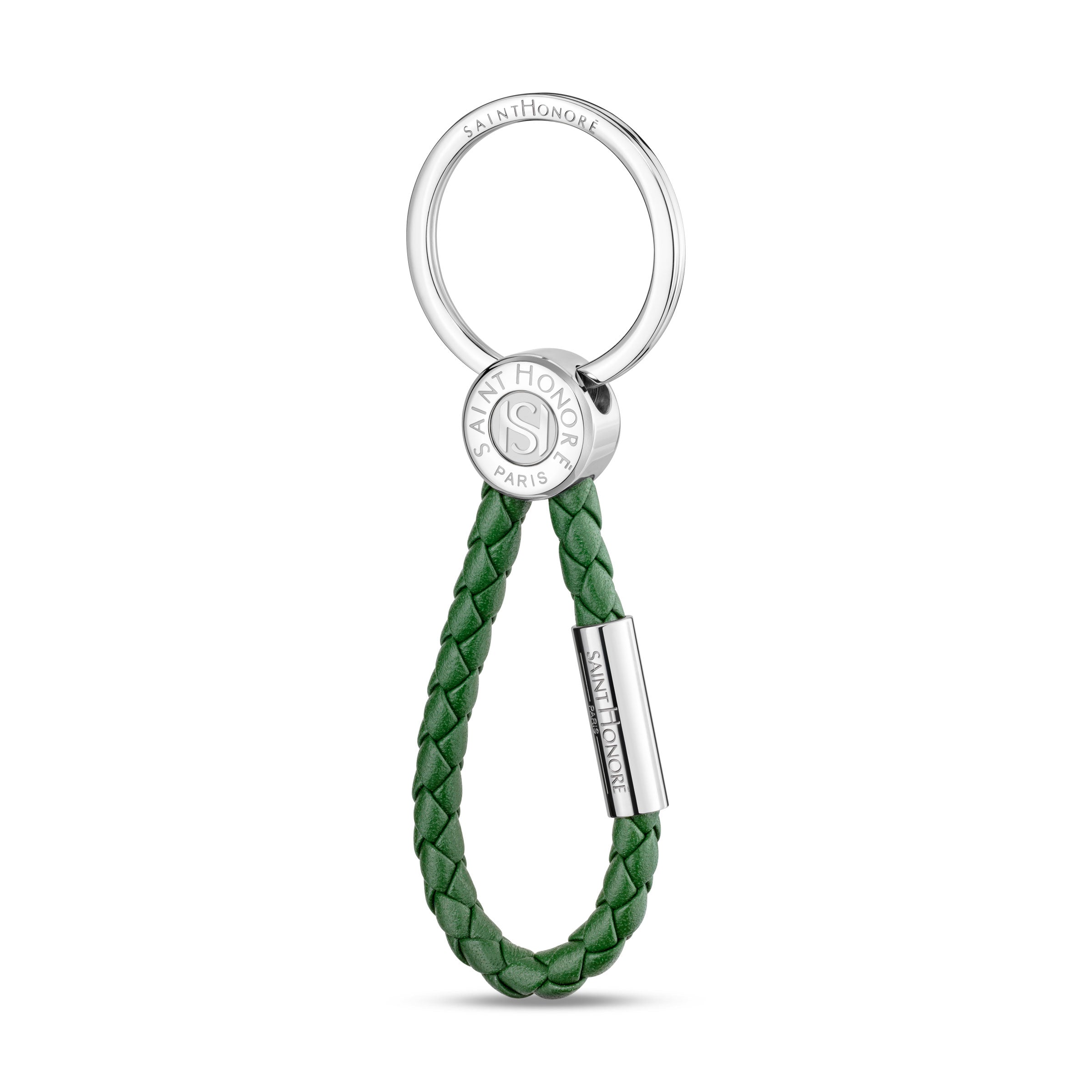 Saint Honore keyring with a silver-toned circular ring, a silver-toned branded disc, and a green braided leather loop.