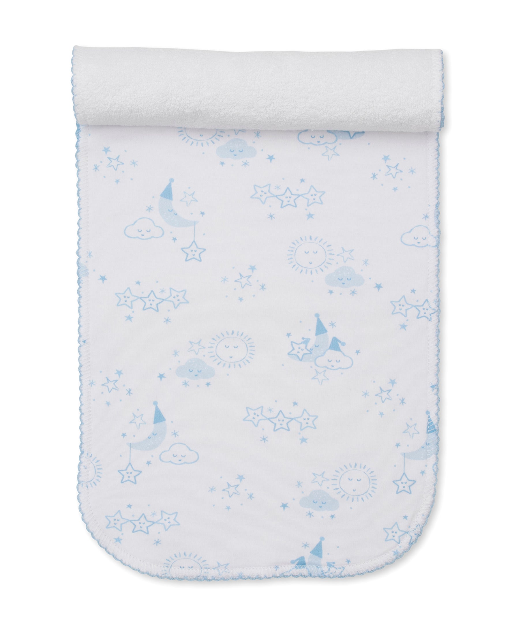Light blue and white patterned burp cloth with a celestial design of moons, stars, clouds, and suns, and a white terry cloth
