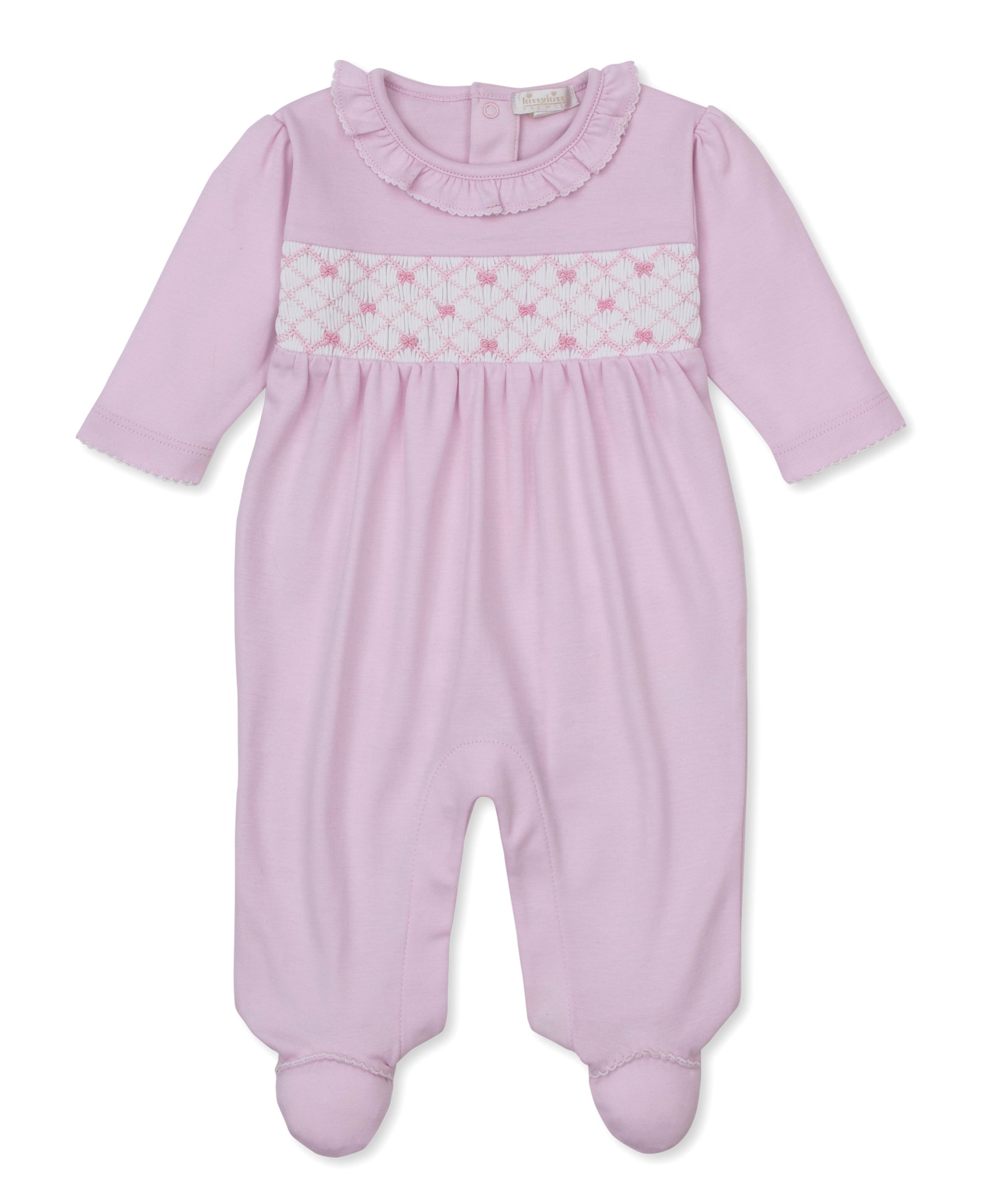 Pink sleepsuit with ruffled collar, white smocked chest panel with pink diamond pattern and bows, long sleeves, and footed de