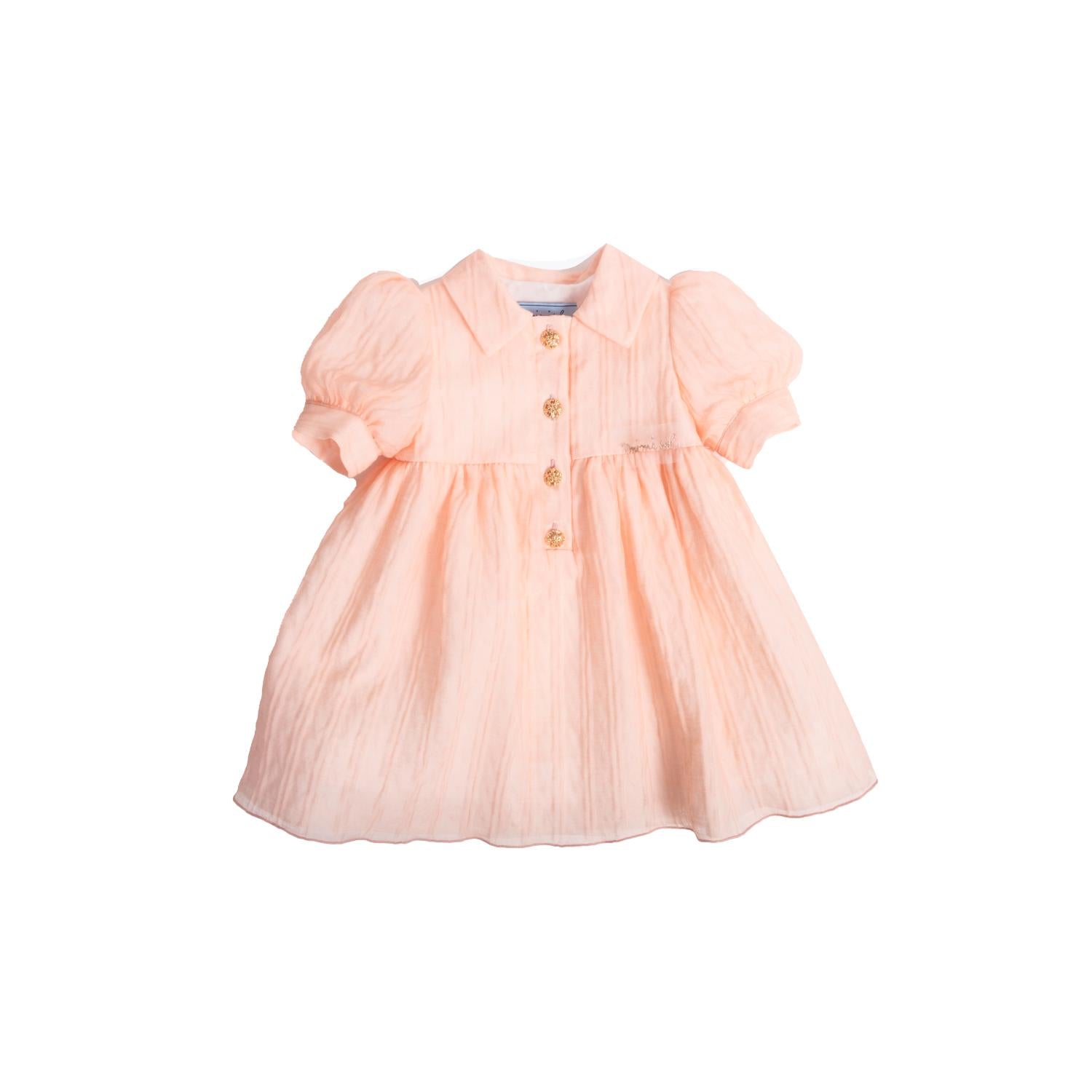 Mimisol baby girl dress in peach-colored textured organza featuring short puff sleeves, a collar, and four decorative gold buttons.