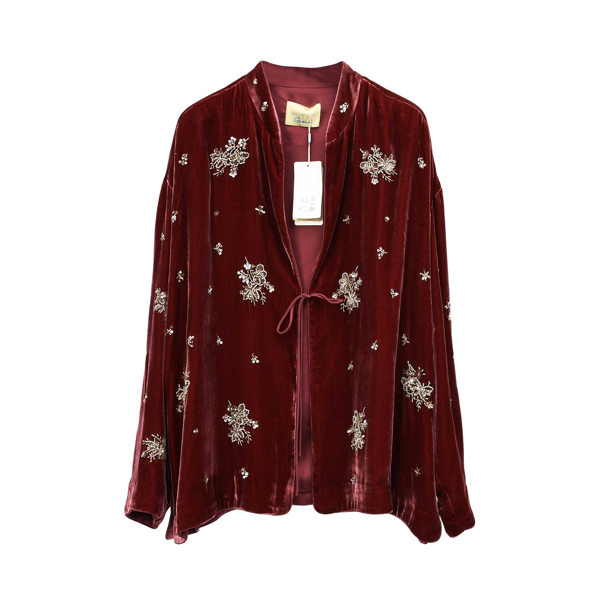 A deep burgundy velvet kimono jacket from MOMONI, adorned with elaborate gold-tone embroidery and sequin patterns. The jacket features a relaxed fit and a front tie closure. A brand tag and product label are visible on the interior. The background is white.