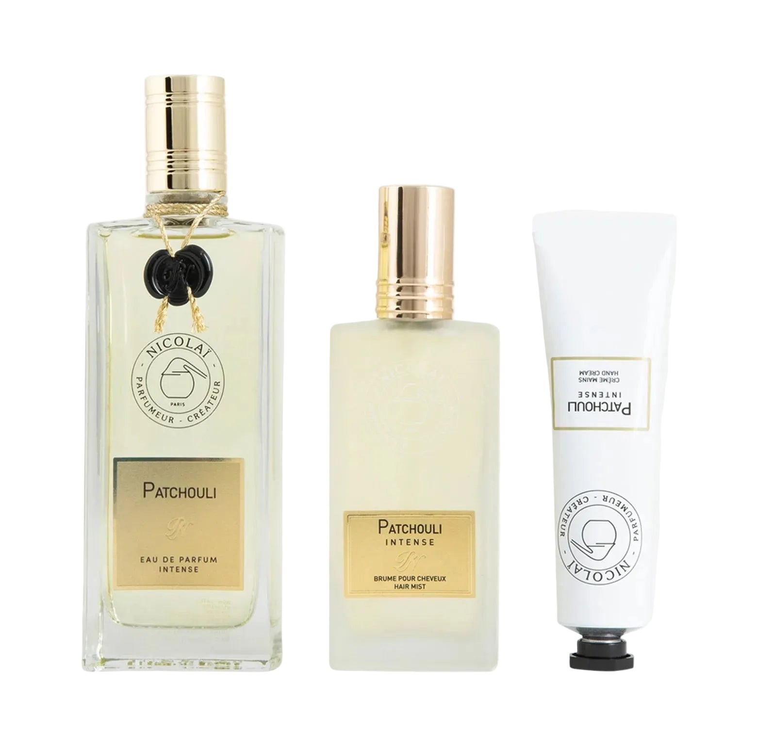 Three Nicolai Patchouli Intense products: a 100ml glass perfume bottle with a black wax seal, a frosted glass hair mist bottle, and a white squeeze tube hand cream.