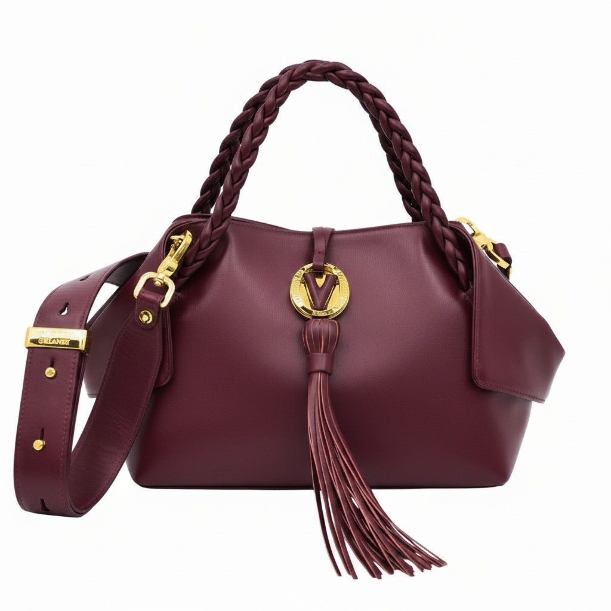 Burgundy leather handbag with braided top handles, a matching shoulder strap, a gold-tone "V" logo emblem, and a long hanging tassel detail at the front, available at BLUE SALON.