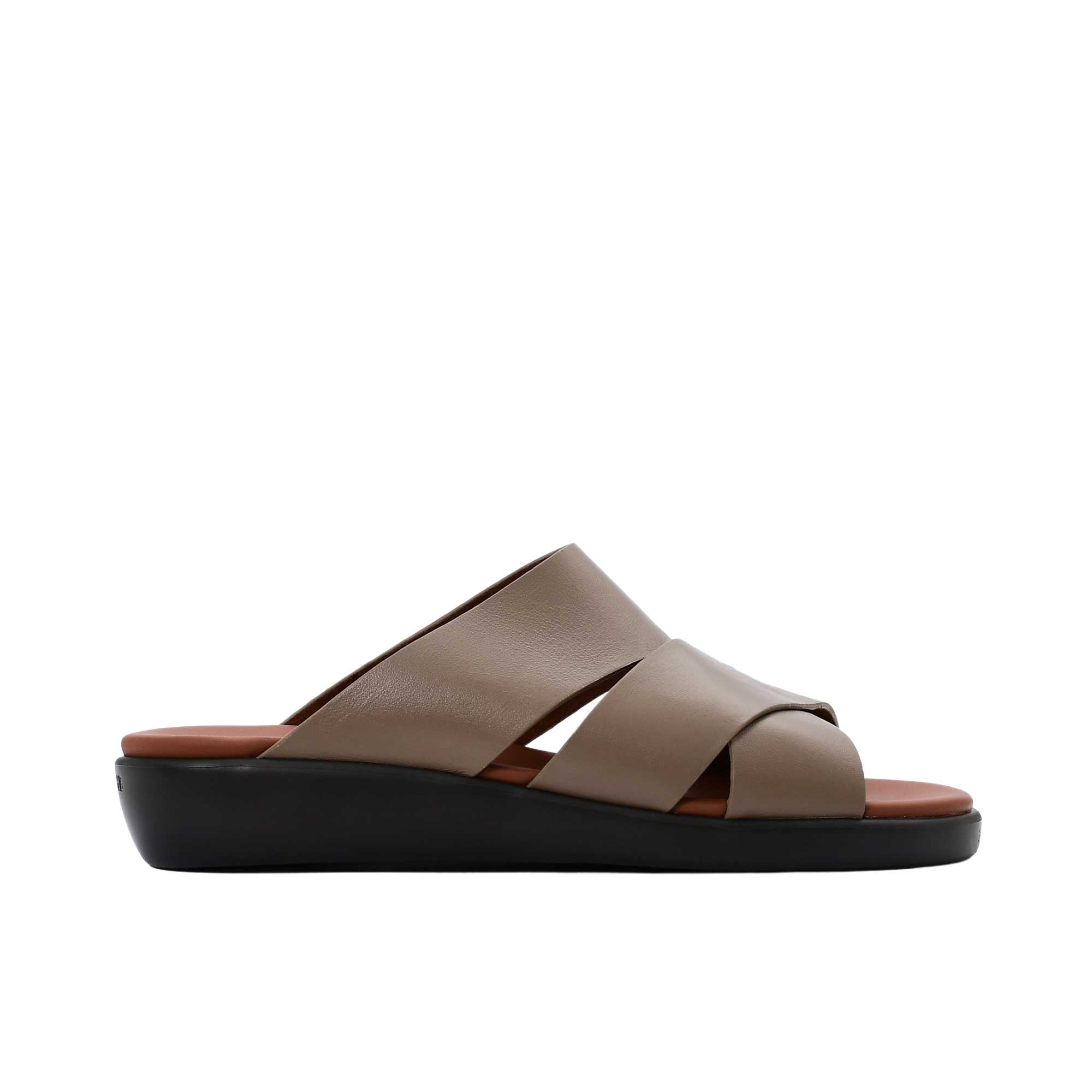 Side profile of a PRESTIGE white leather slide sandal featuring a thick taupe ergonomic wedge sole and tan footbed.