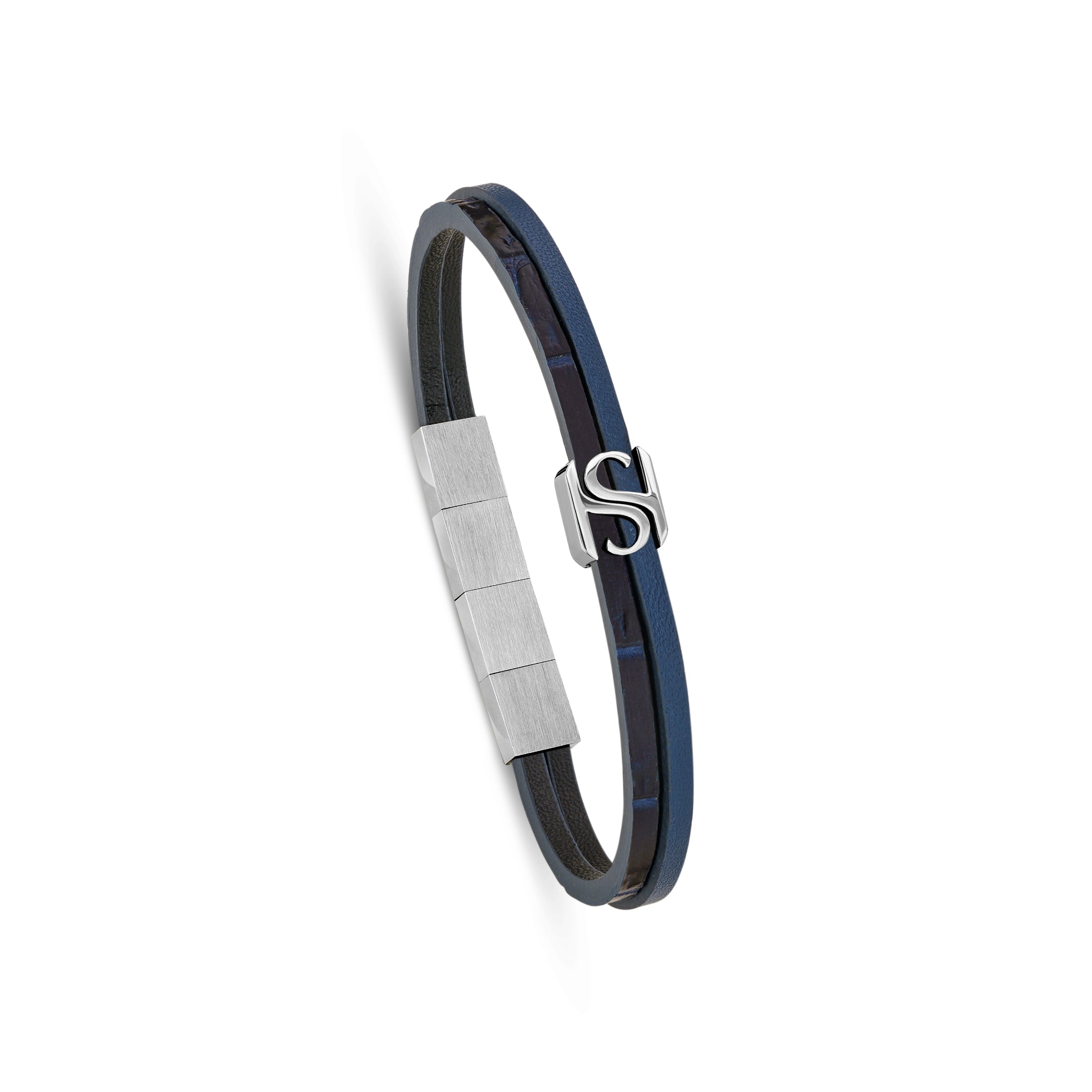 A three-quarter profile studio view of the Saint Honoré B47 bracelet, showcasing the smooth navy blue leather band adjacent to the crocodile-textured strand, finished with the central silver-tone SH logo and a brushed steel clasp.