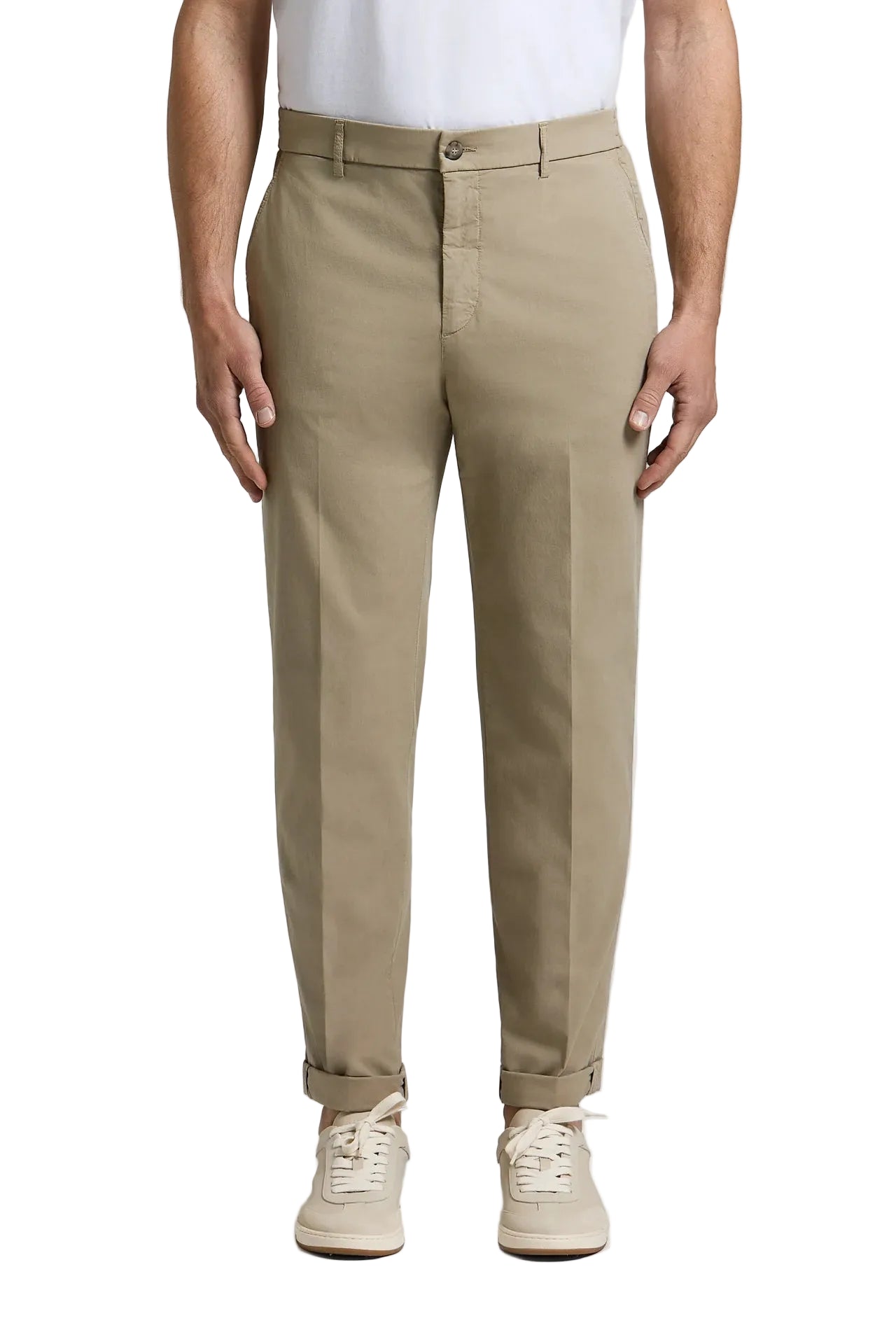 Beige cotton poplin jogger trousers with a relaxed fit, cuffed hems, belt loops, and side pockets.