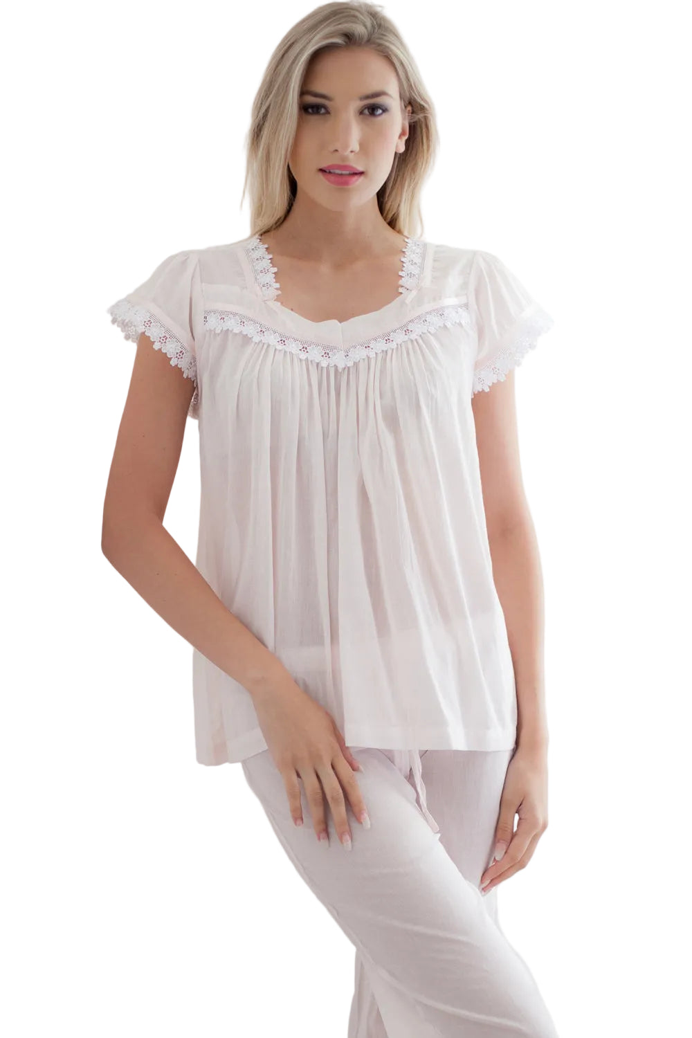 Salmon pink SuperVoile pyjama set with a relaxed-fit top, cap sleeves, white lace trim, and matching drawstring trousers.