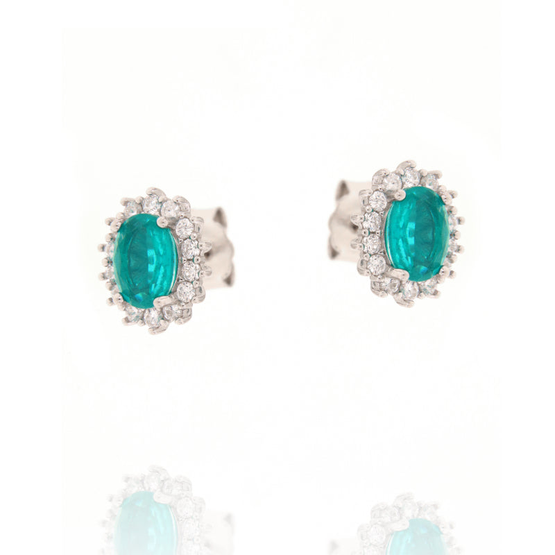 Pair of silver-toned stud earrings, each with an oval green central stone surrounded by a halo of clear round stones.