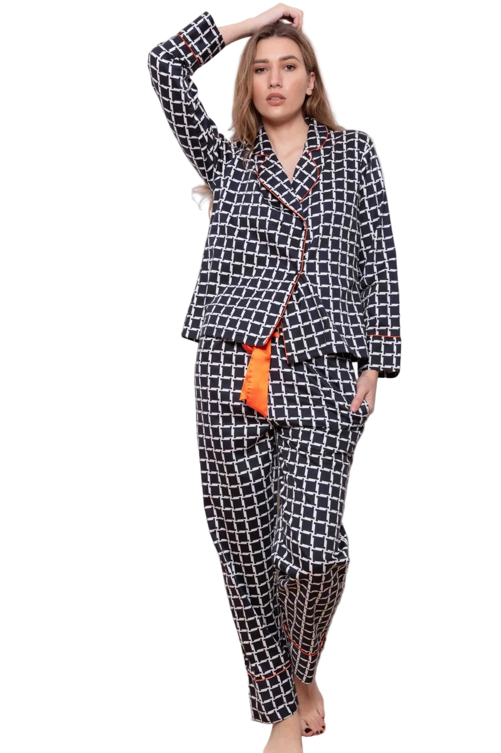Midnight blue and white geometric pattern pyjama set with orange piping and drawstring.