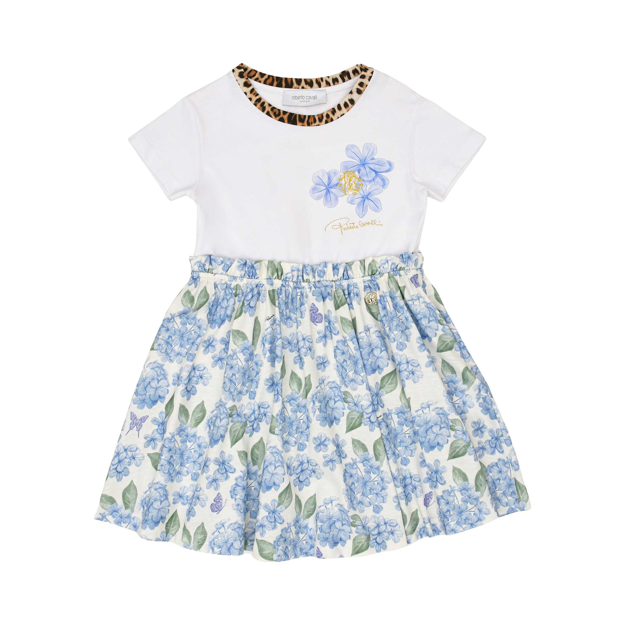 Front view of a Roberto Cavalli girl's white t-shirt dress featuring a leopard-print collar, blue hydrangea chest graphics with a gold RC monogram, and a gathered blue floral skirt, available at BLUE SALON.