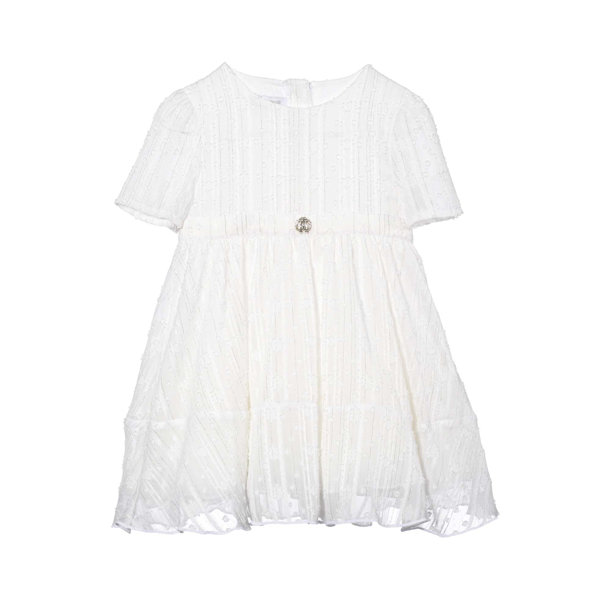 Front view of a white Roberto Cavalli girl's occasion dress featuring short sleeves, shimmering silver pinstripes, an empire waist, and a silver "RC" logo emblem at the center, available at BLUE SALON.