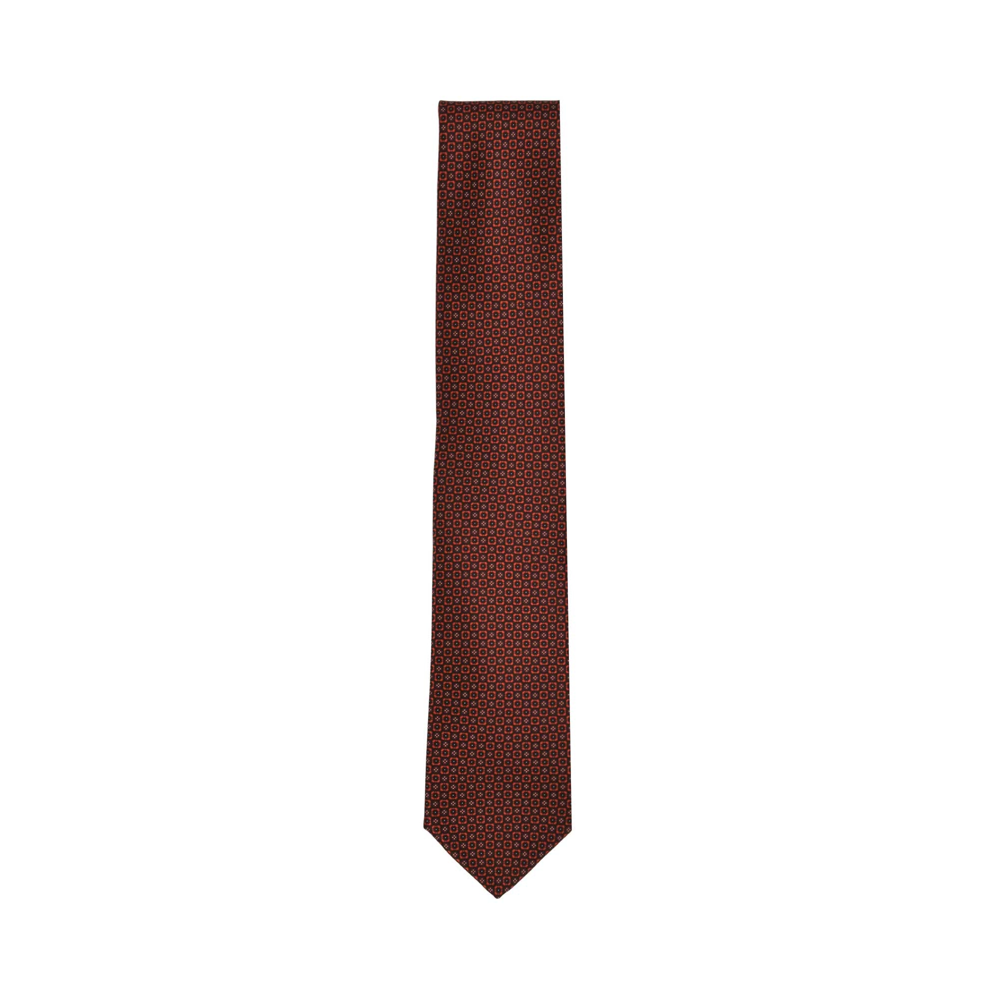Burgundy necktie with a repeating pattern of small orange and red geometric motifs, featuring a pointed tip.
