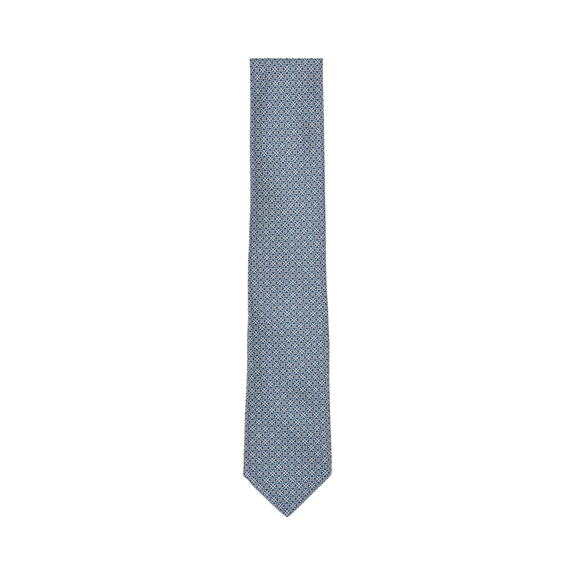 Light blue and navy geometric pattern silk necktie with a pointed tip