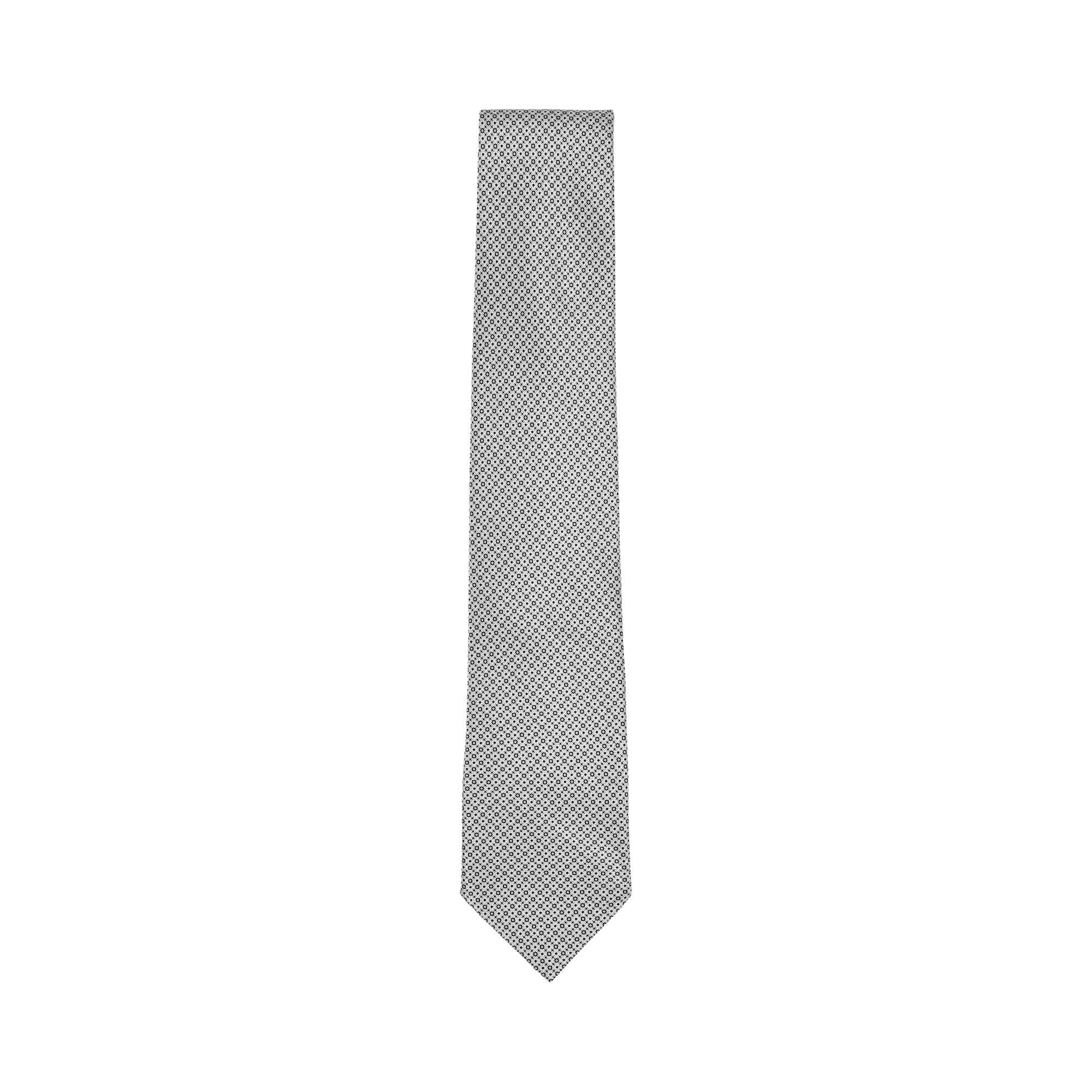 Grey silk necktie with a repeating small geometric circular pattern and a pointed tip
