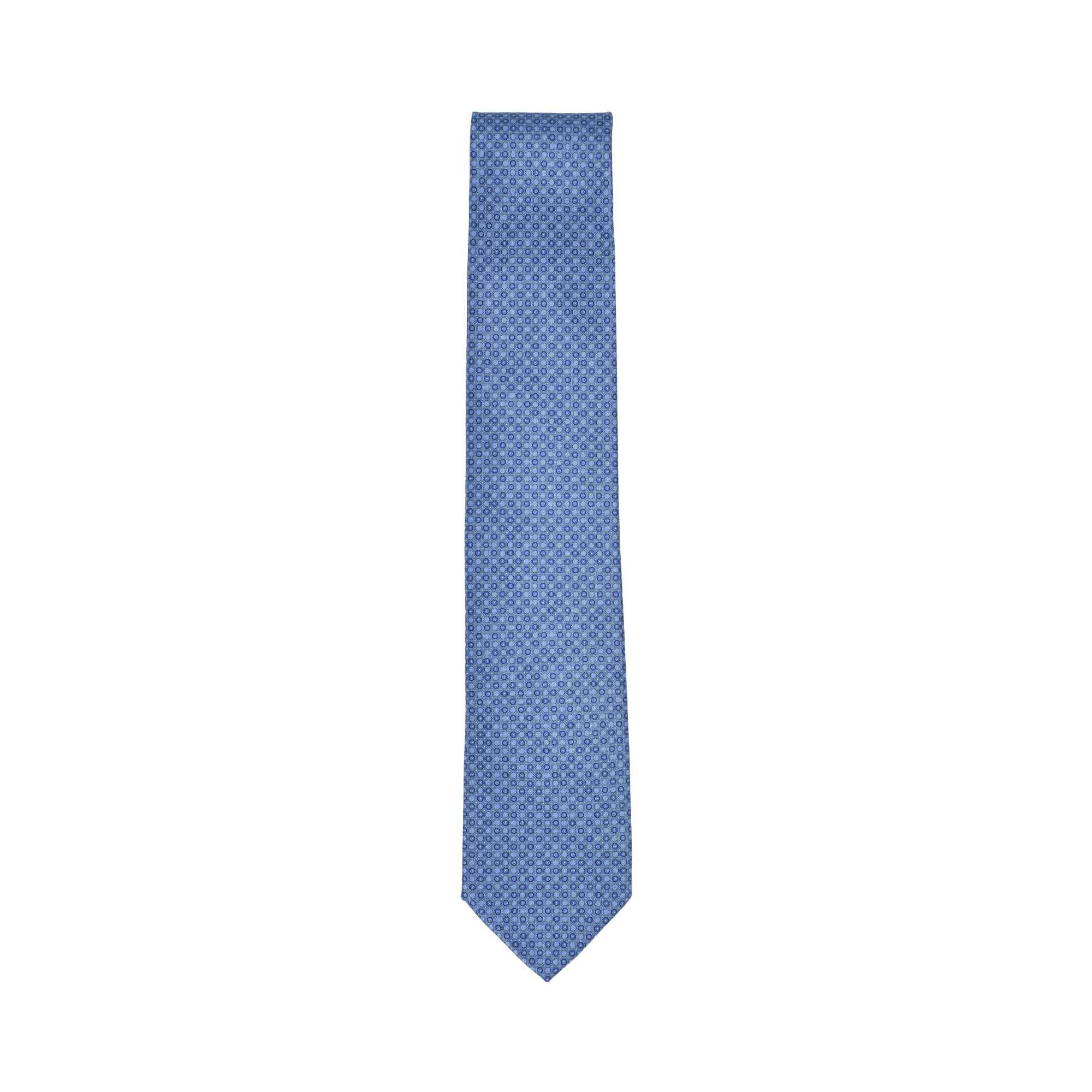 Light blue Stefano Ricci silk tie with a small, repeating geometric pattern, tapering to a pointed end.