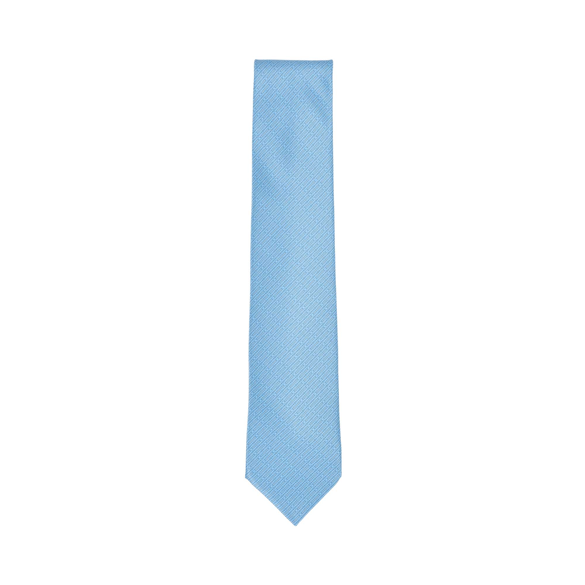 Light blue necktie with a subtle diagonal geometric pattern, tapering to a pointed end.