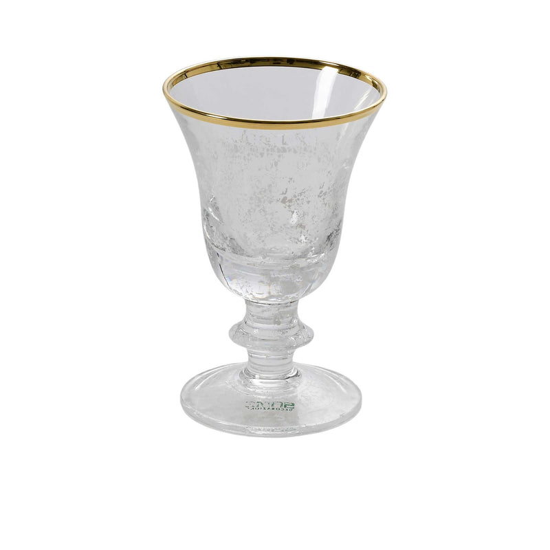 A single stemmed crystal glass with a shimmering silver speckle pattern, a flared bowl, and a 24k gold-painted rim.