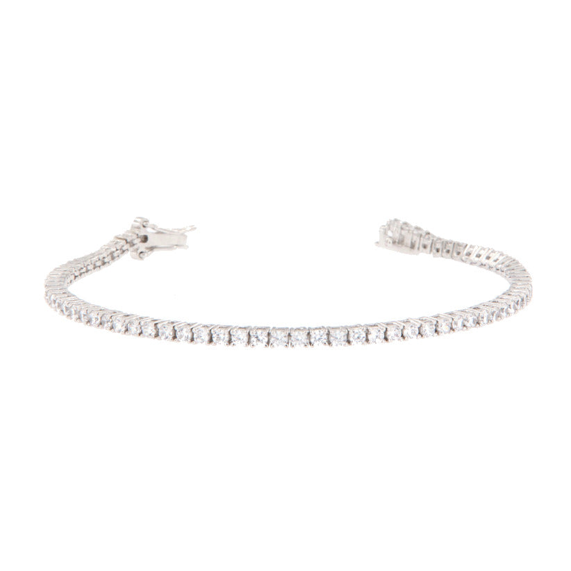Silver-toned tennis bracelet with a continuous line of clear, brilliant-cut stones and a box clasp.