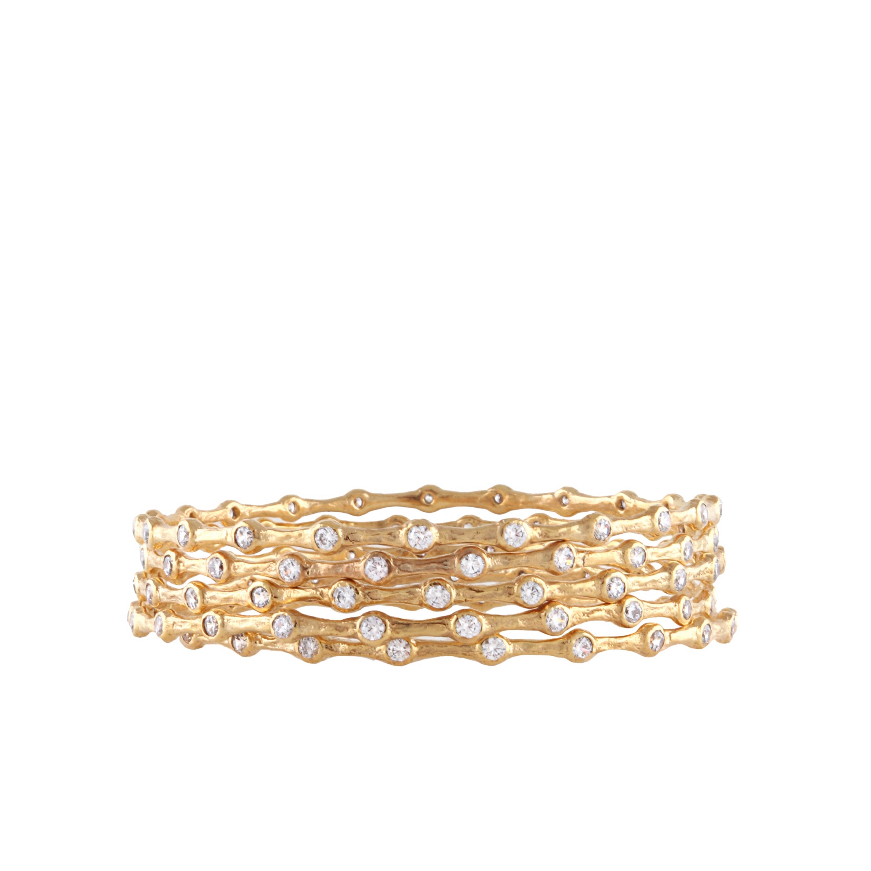Set of five gold-toned metal bangles with a wavy, textured surface, each adorned with numerous round, clear handset stones.