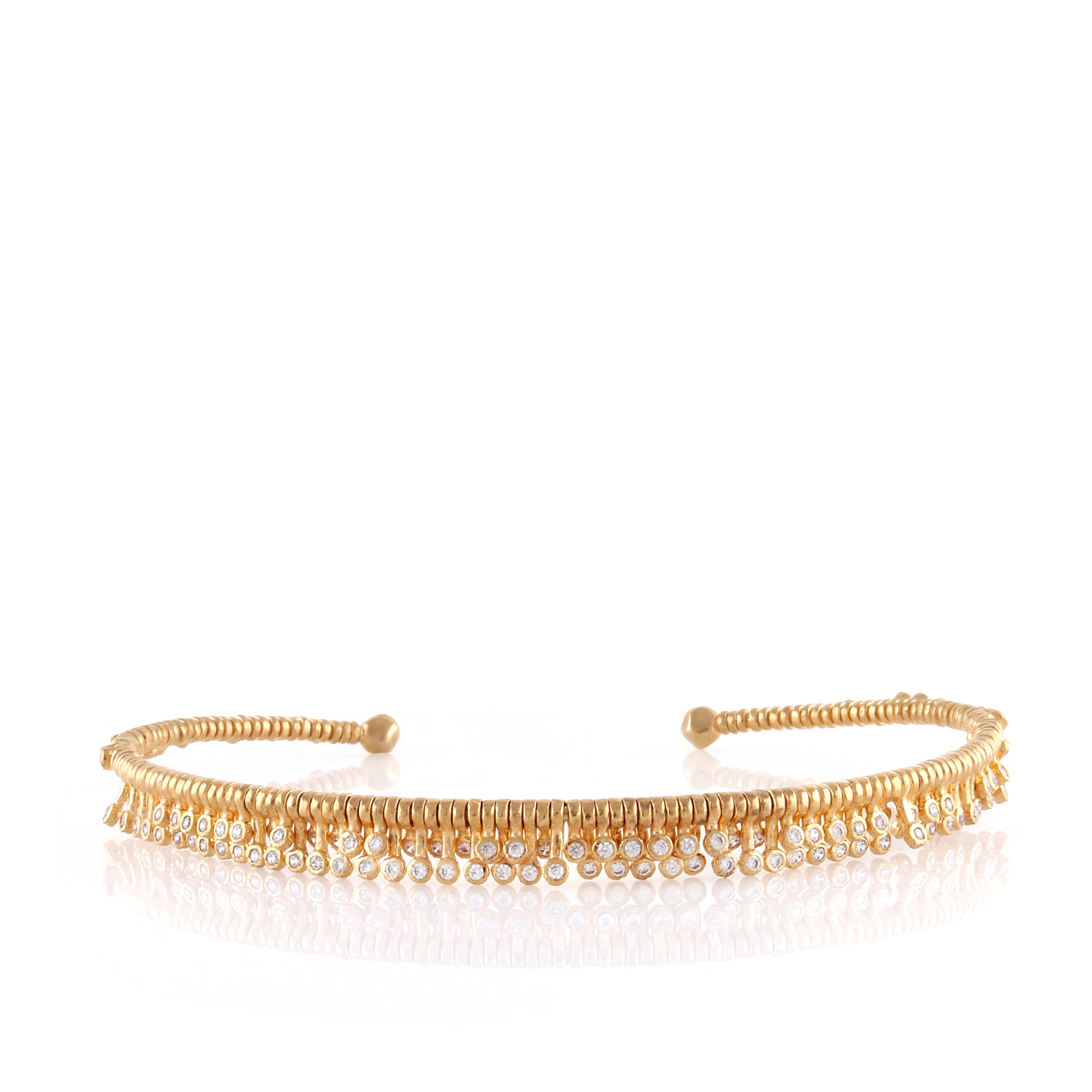 Gold-toned open-ended choker with a textured band and multiple rows of small clear stones dangling from the front.