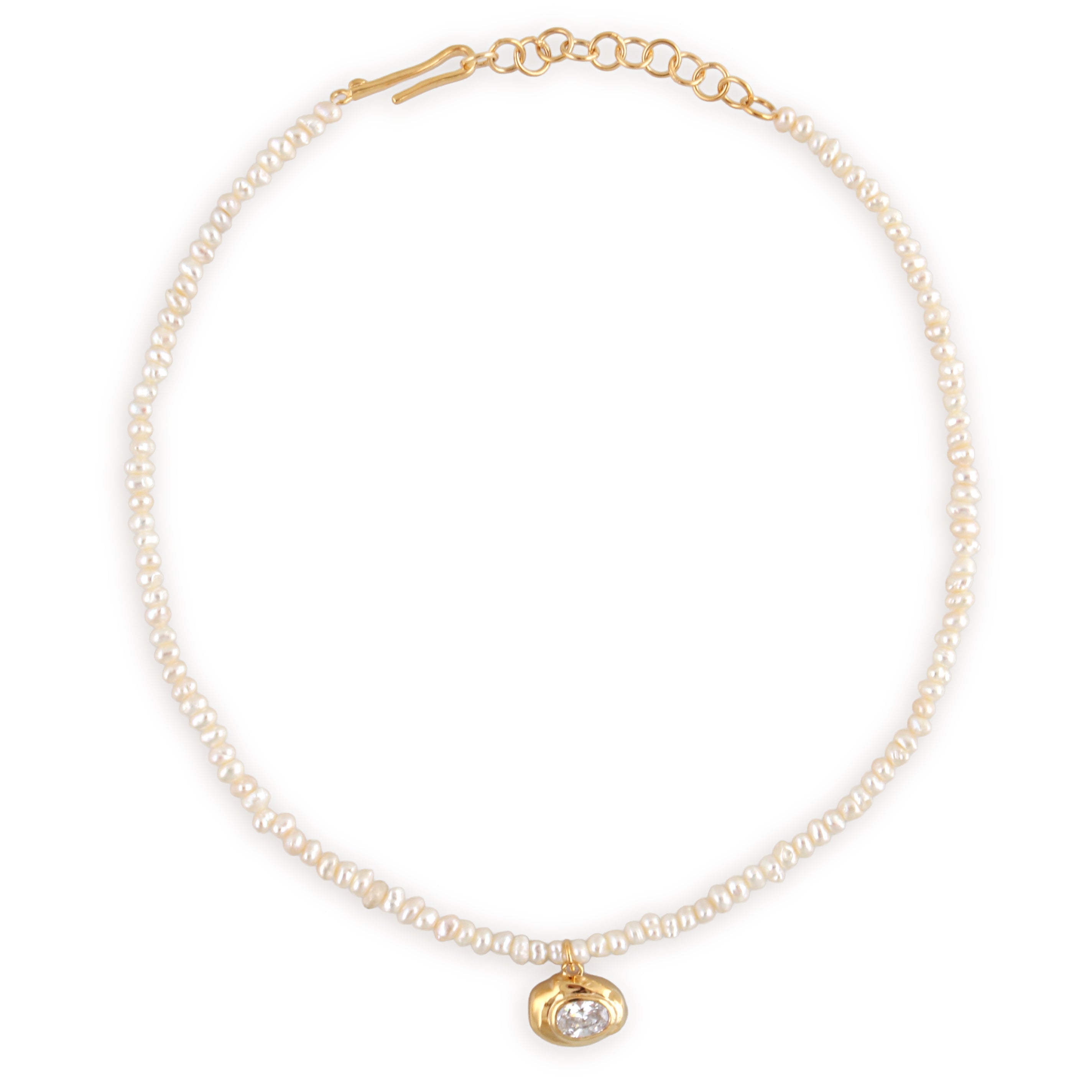White pearl choker with a gold-toned oval pendant featuring a clear stone, and a gold-toned hook clasp with extender chain