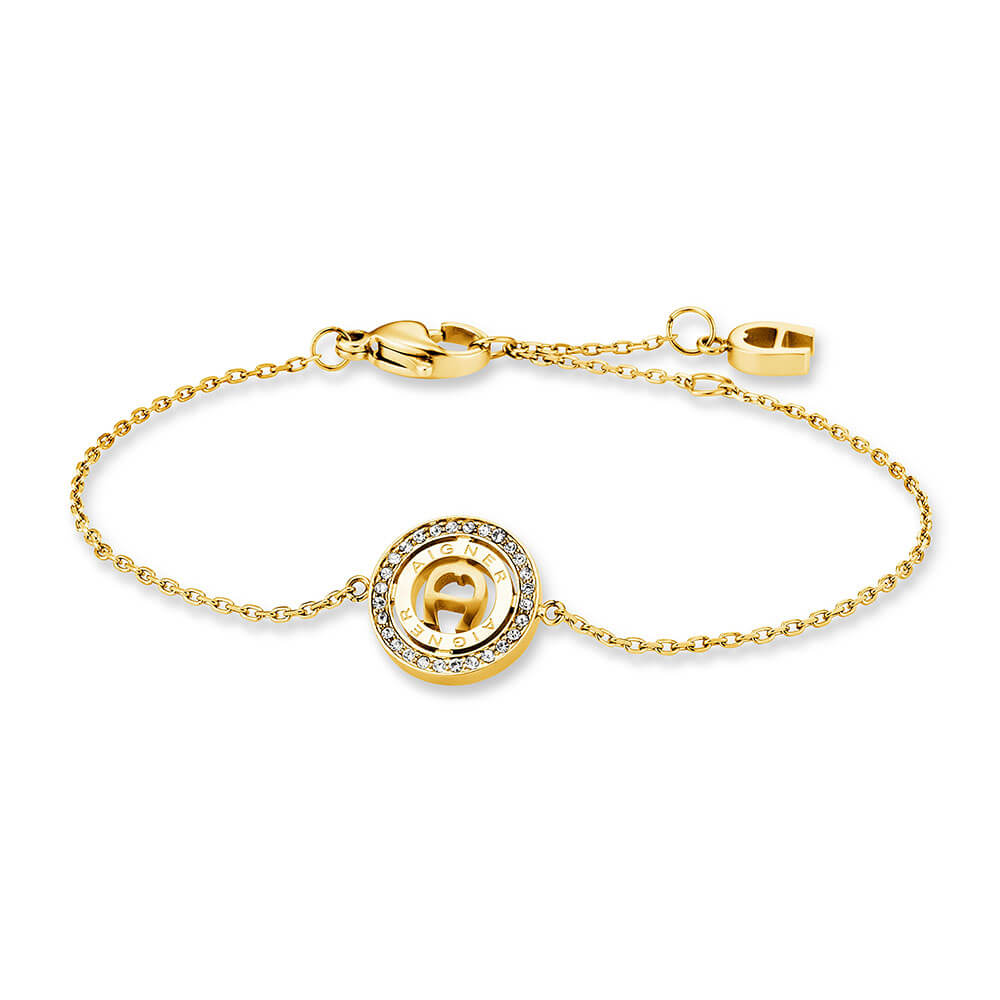 Gold-toned stainless steel bracelet with a central circular charm featuring the Aigner 'A' logo surrounded by clear stones.