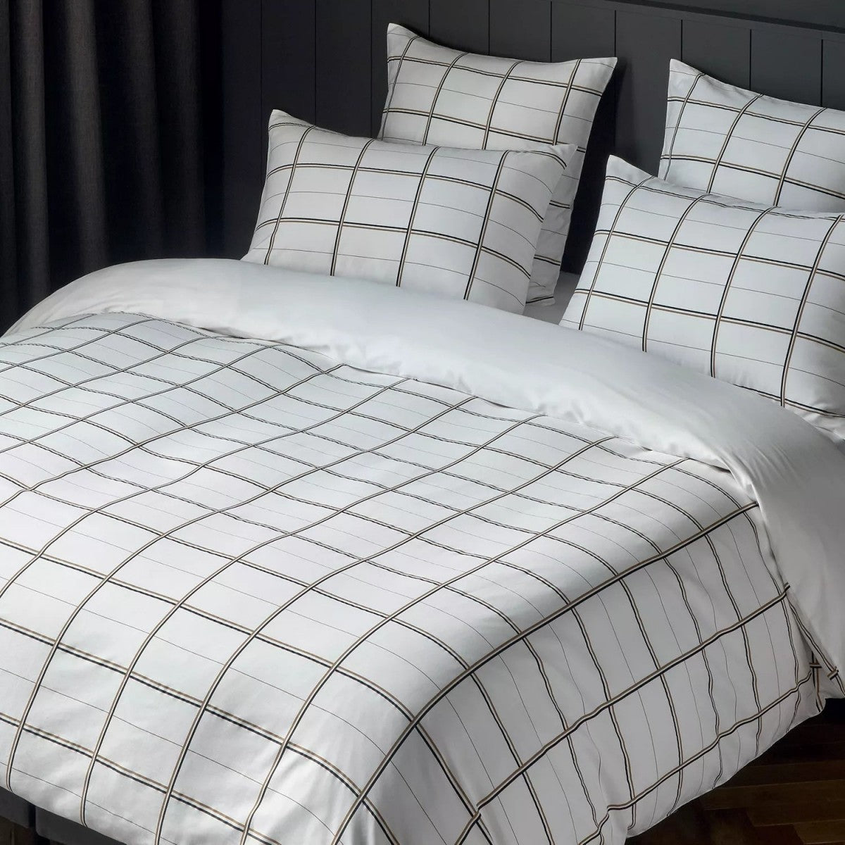 White duvet cover and pillow cases with a black and grey grid pattern