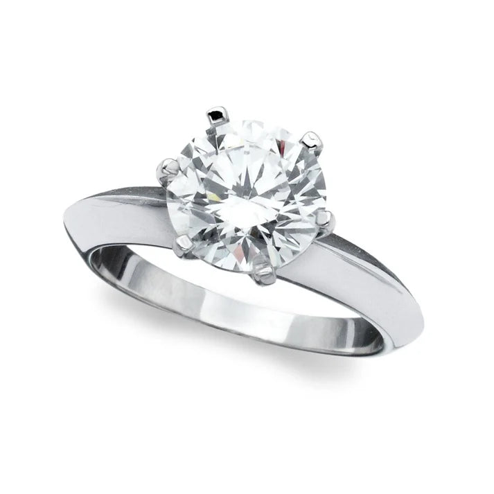 Silver-toned plated ring with a large, round, clear brilliant-cut cubic zirconia stone in a six-prong setting.