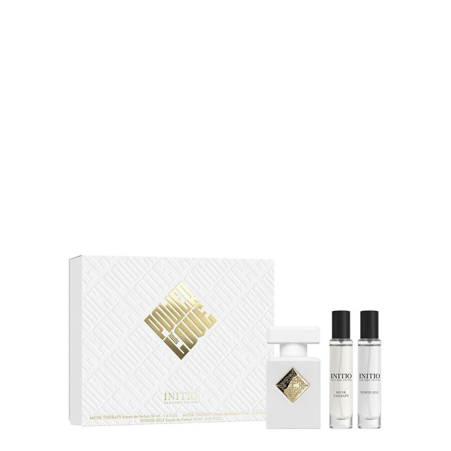 Initio Parfums Privés Musk Therapy 3-piece luxury fragrance gift set featuring a 50ml white bottle, two 10ml travel sprays of Musk Therapy and Power Self, and an elegant textured white box with gold lettering, available at blue salon.