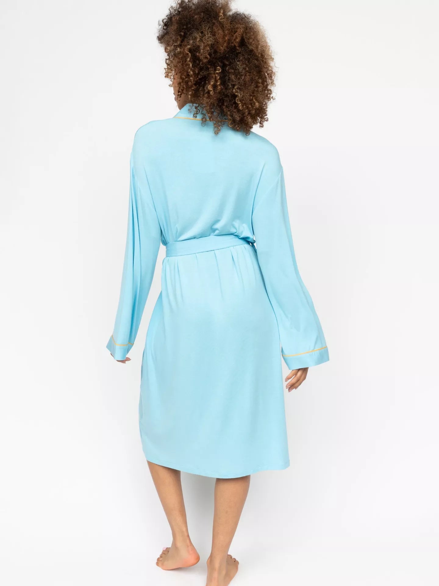 Light blue jersey short dressing gown with long sleeves, self-tie belt, and yellow-toned piping on the collar and cuffs.
